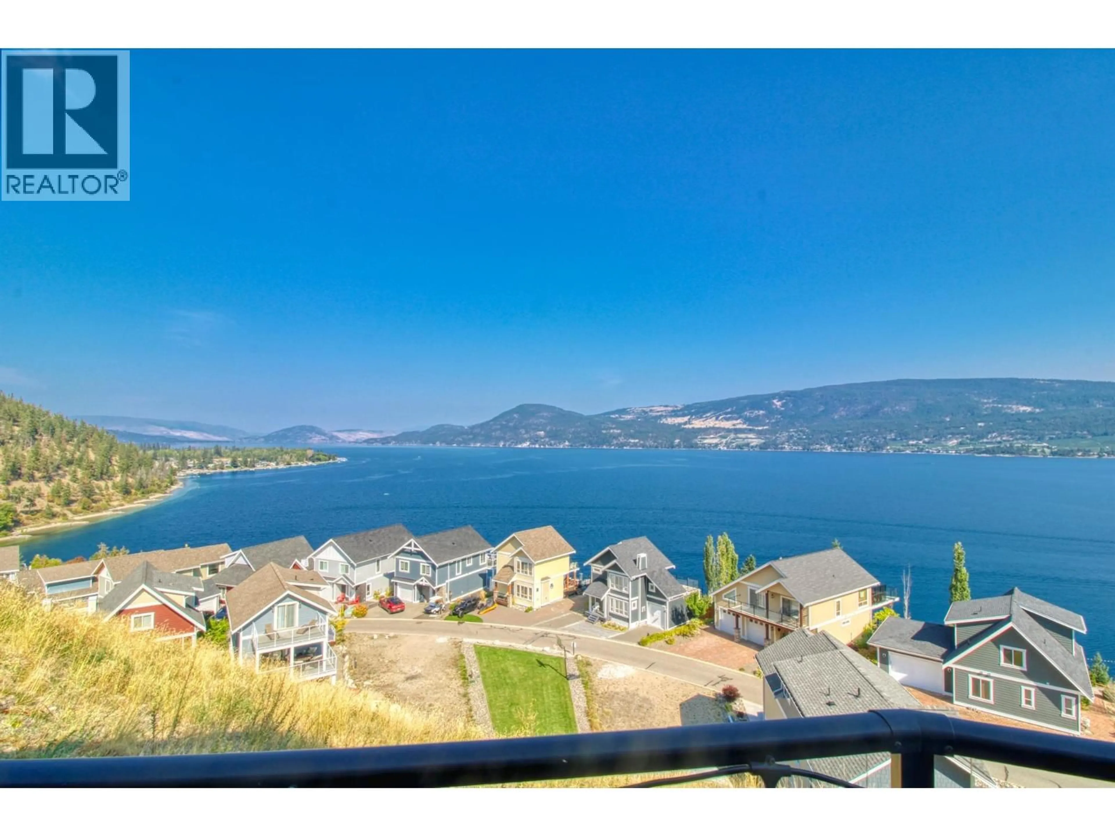 A pic from outside/outdoor area/front of a property/back of a property/a pic from drone, water/lake/river/ocean view for 64 - 6933 BARCELONA DRIVE, Kelowna British Columbia V1Z3R8