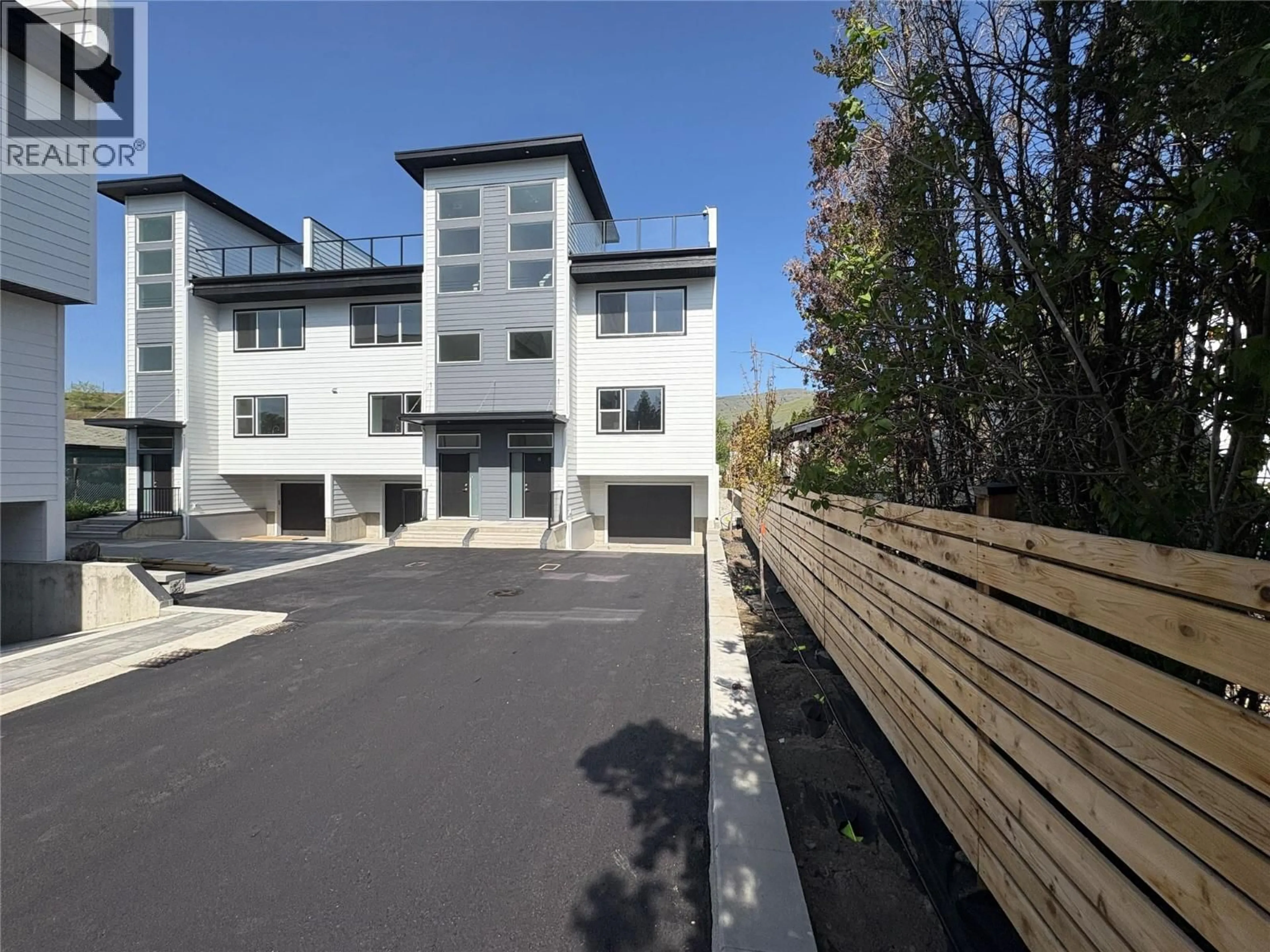 A pic from outside/outdoor area/front of a property/back of a property/a pic from drone, street for 5 - 5661 OKANAGAN LANDING ROAD, Vernon British Columbia V1T7A6