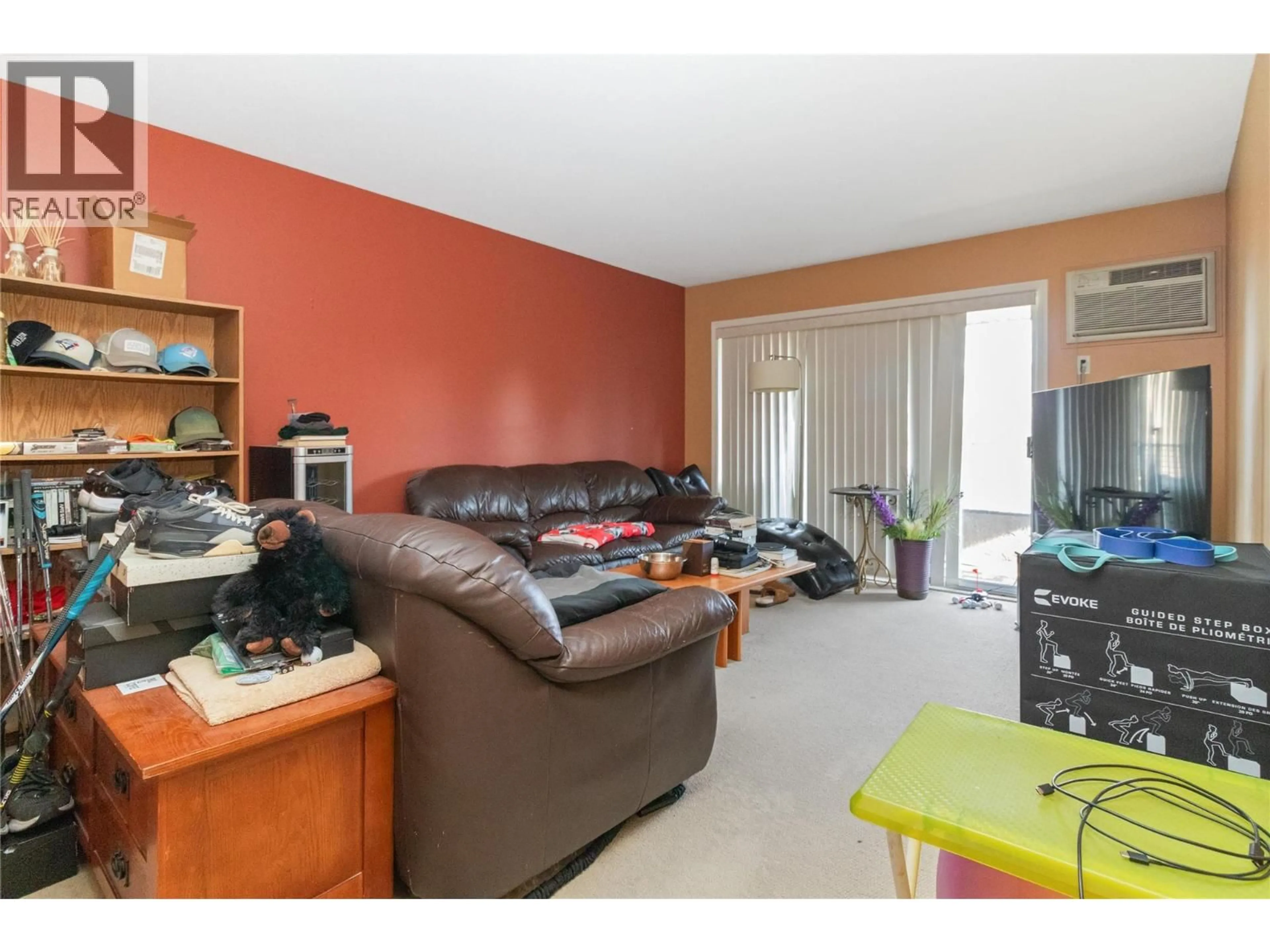Living room with furniture, wood/laminate floor for 403 - 2025 BARON ROAD, Kelowna British Columbia V1X7G3