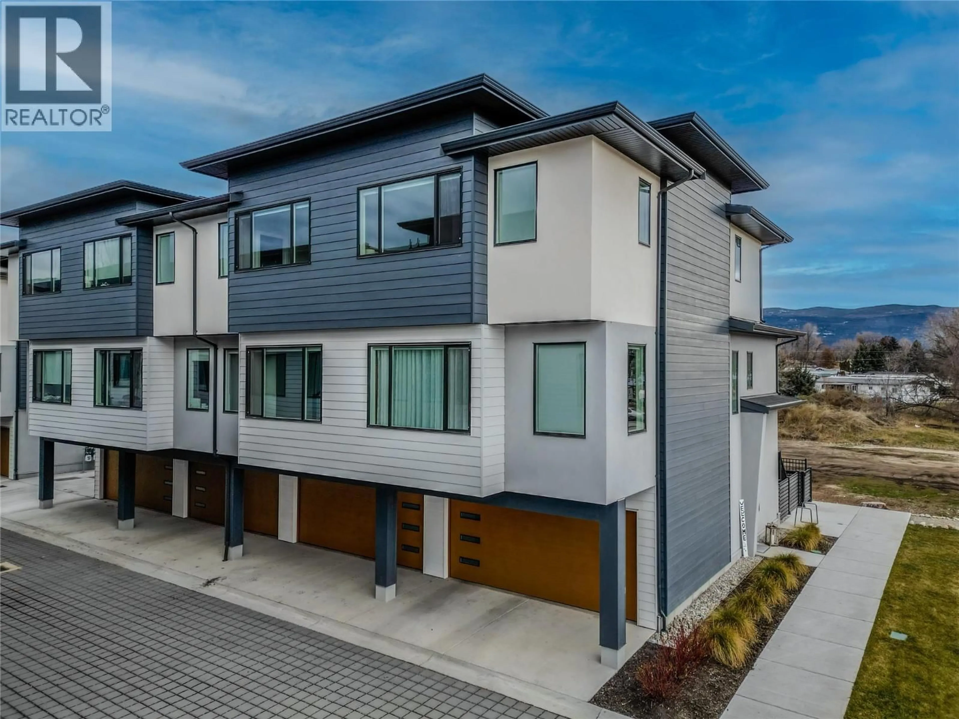 A pic from outside/outdoor area/front of a property/back of a property/a pic from drone, street for 12 - 1225 FINDLAY ROAD, Kelowna British Columbia V1X5B1