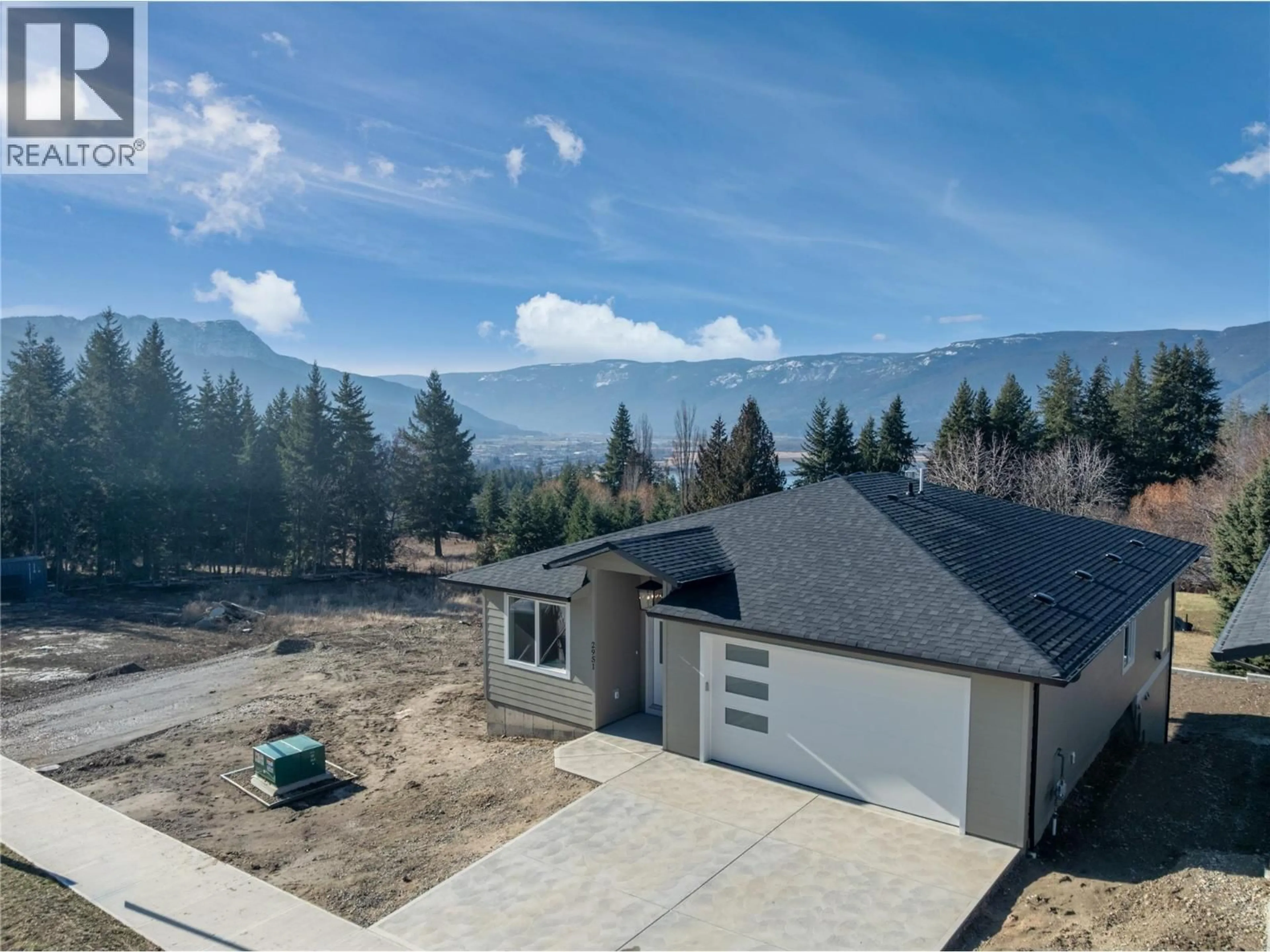 A pic from outside/outdoor area/front of a property/back of a property/a pic from drone, mountain view for 2951 27 STREET NORTHEAST, Salmon Arm British Columbia V1E2Z7