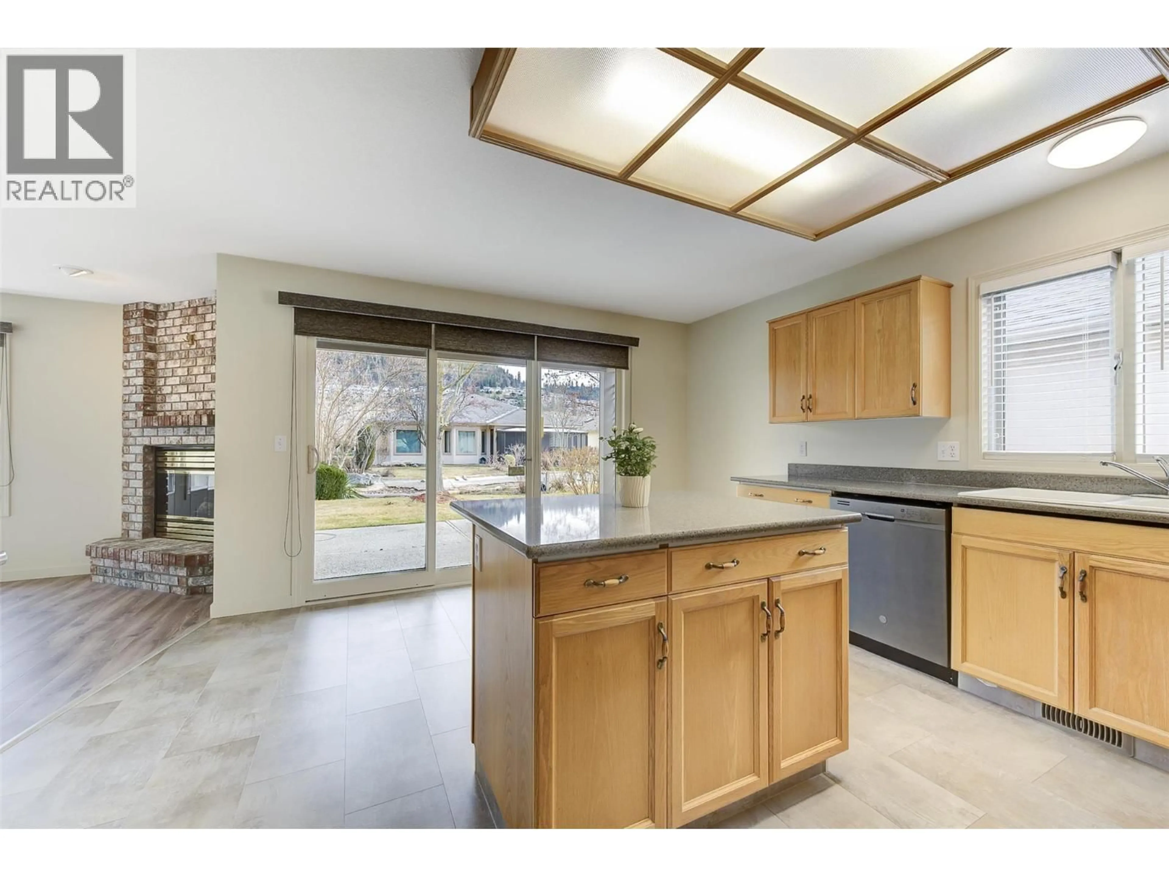 Open concept kitchen, ceramic/tile floor for 203 - 595 YATES ROAD, Kelowna British Columbia V1V1P8