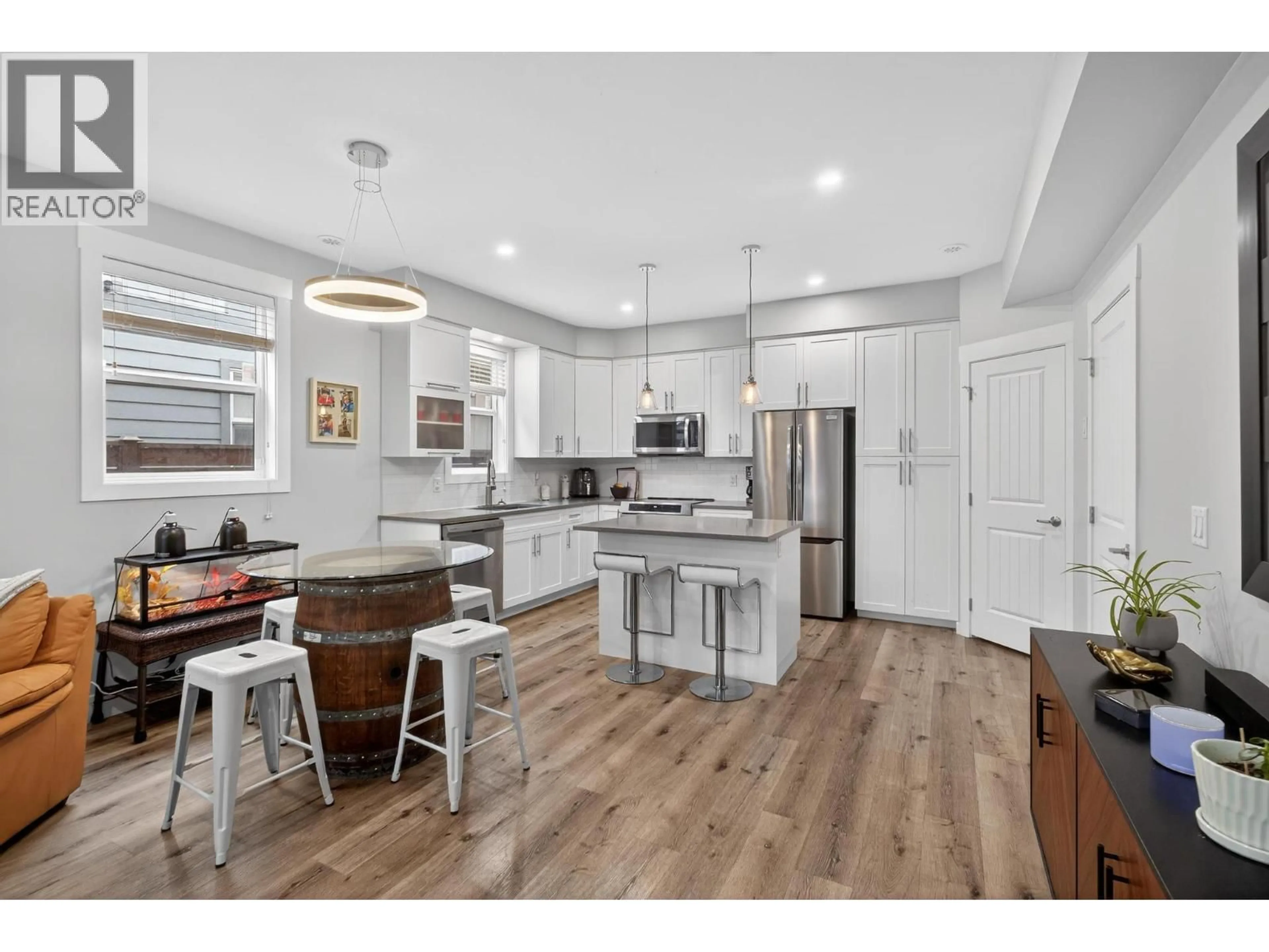 Open concept kitchen, wood/laminate floor for 1934 ETHEL STREET, Kelowna British Columbia V1Y2Z5