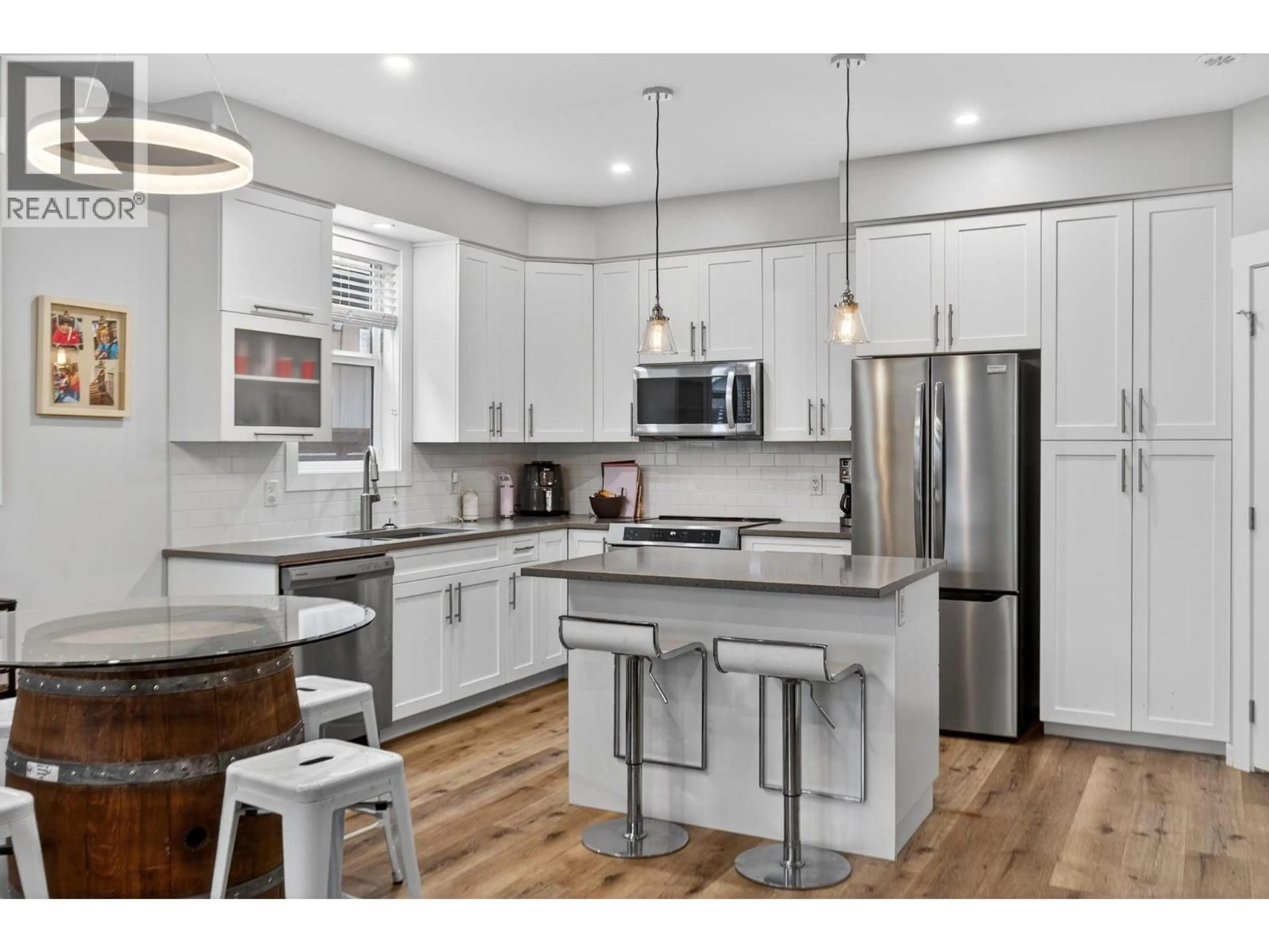 Open concept kitchen, wood/laminate floor for 1934 ETHEL STREET, Kelowna British Columbia V1Y2Z5