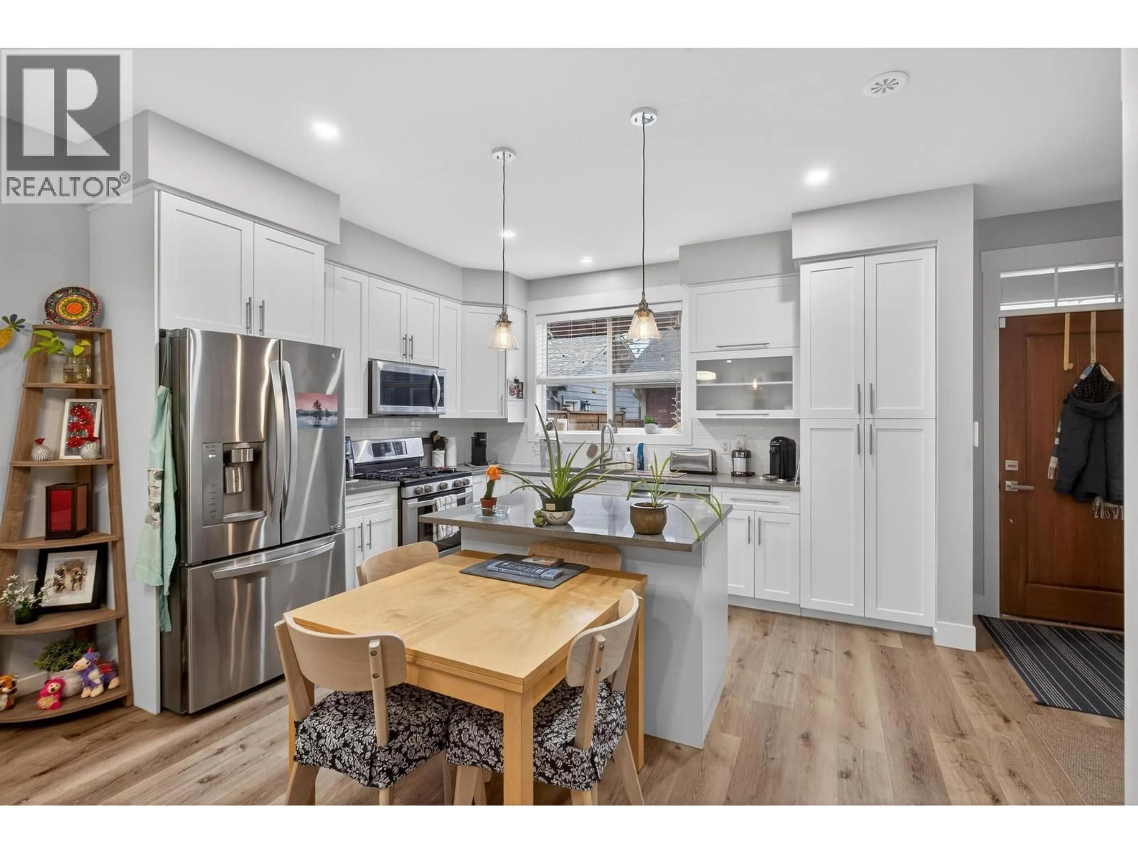 Open concept kitchen, wood/laminate floor for 1936 ETHEL STREET, Kelowna British Columbia V1Y2Z5