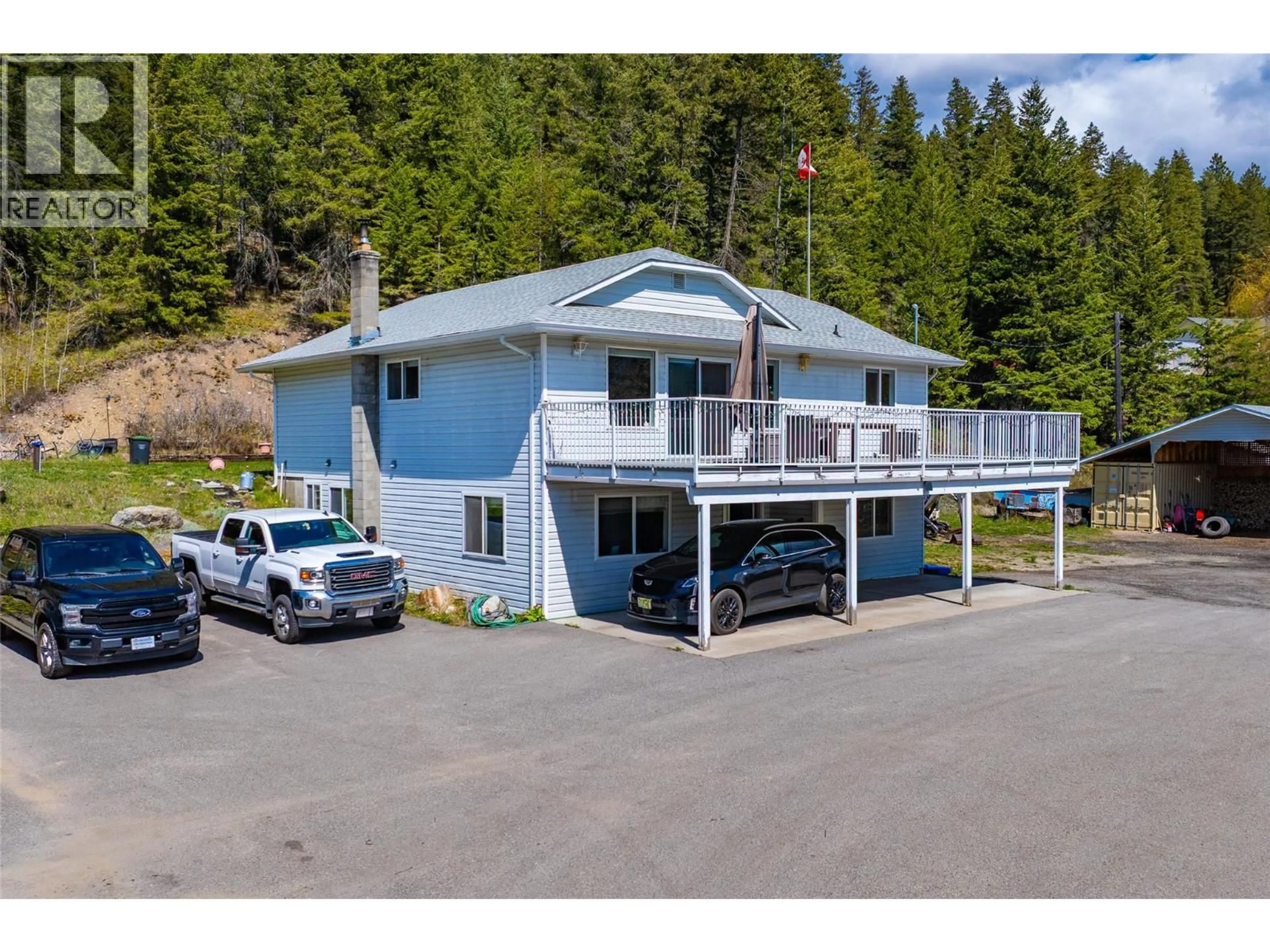 A pic from outside/outdoor area/front of a property/back of a property/a pic from drone, water/lake/river/ocean view for 7114 GOSHAWK ROAD, Kelowna British Columbia V1P1H9