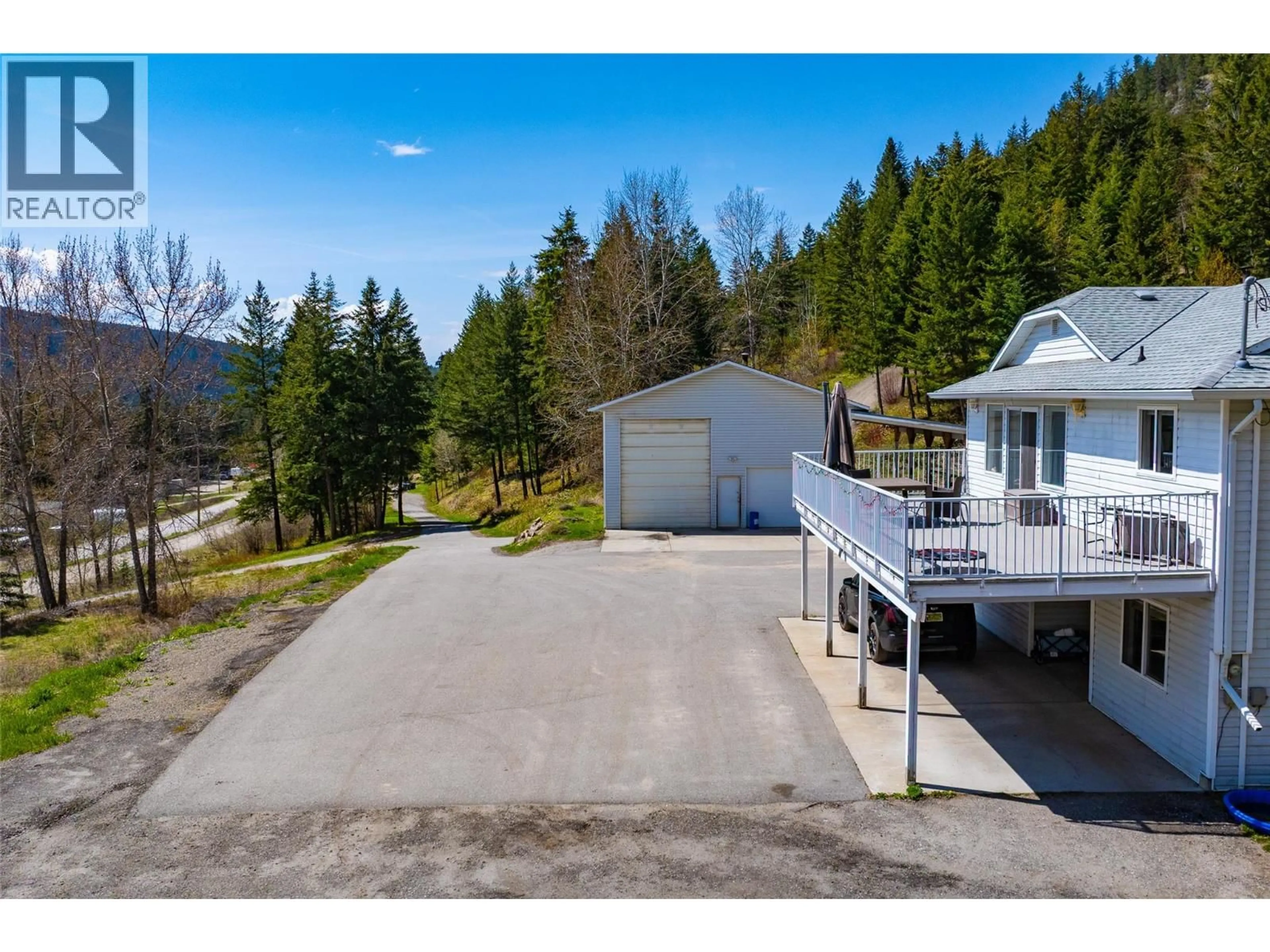 A pic from outside/outdoor area/front of a property/back of a property/a pic from drone, unknown for 7114 GOSHAWK ROAD, Kelowna British Columbia V1P1H9