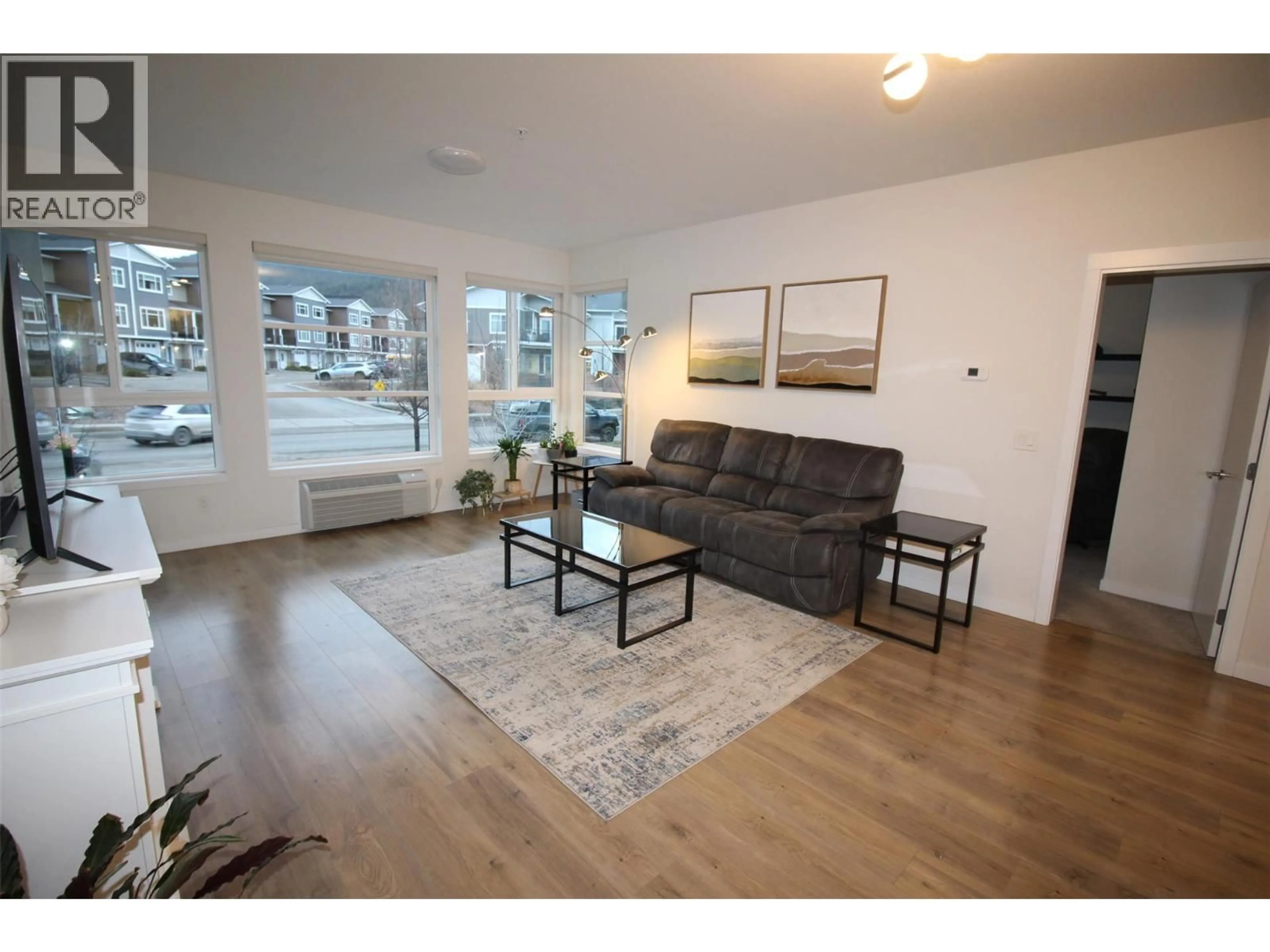 Living room with furniture, wood/laminate floor for 204 - 1880 HUGH ALLAN DRIVE, Kamloops British Columbia V1S0E8
