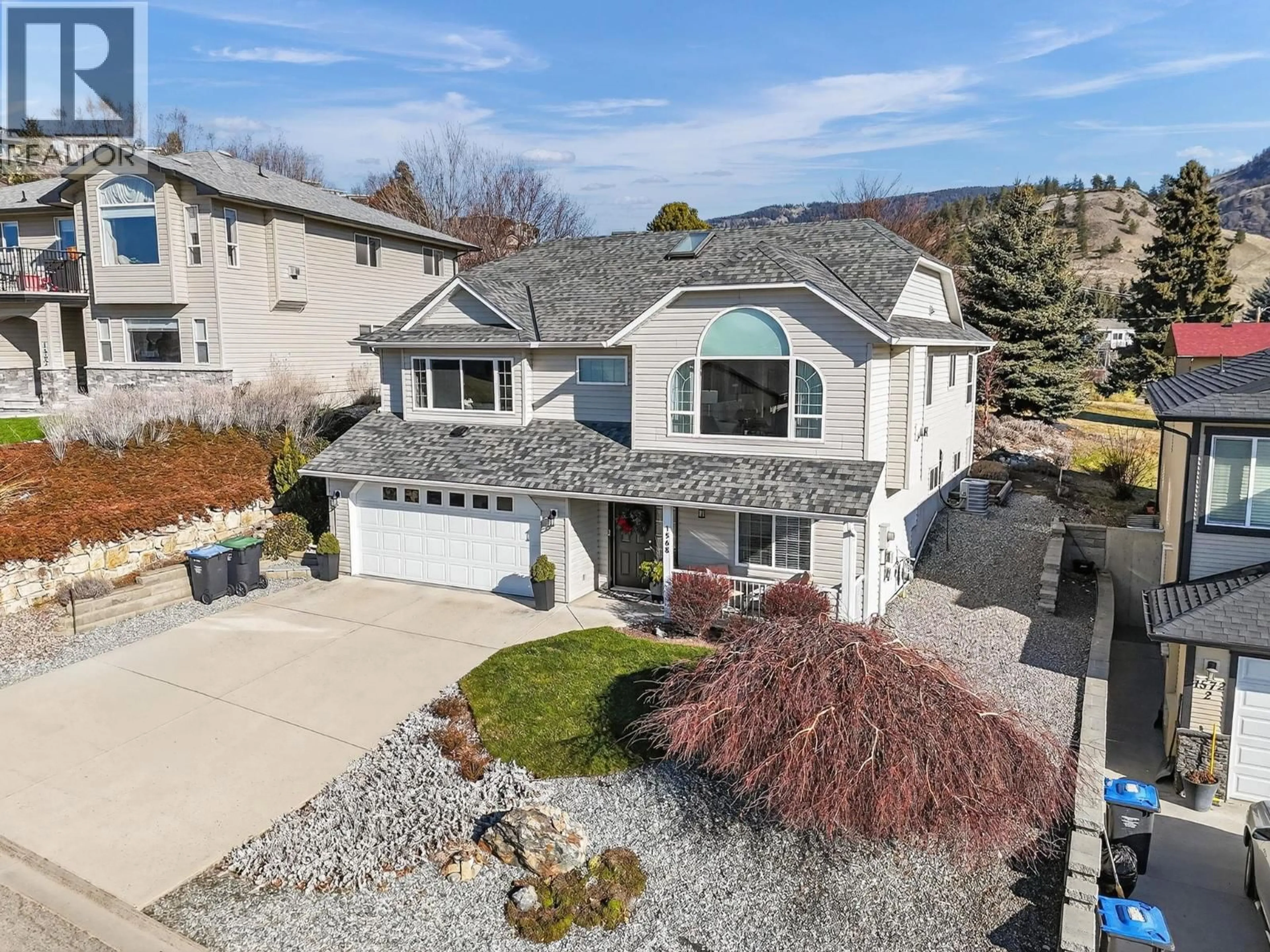 A pic from outside/outdoor area/front of a property/back of a property/a pic from drone, street for 1568 LONGLEY CRESCENT, Kelowna British Columbia V1P1M9