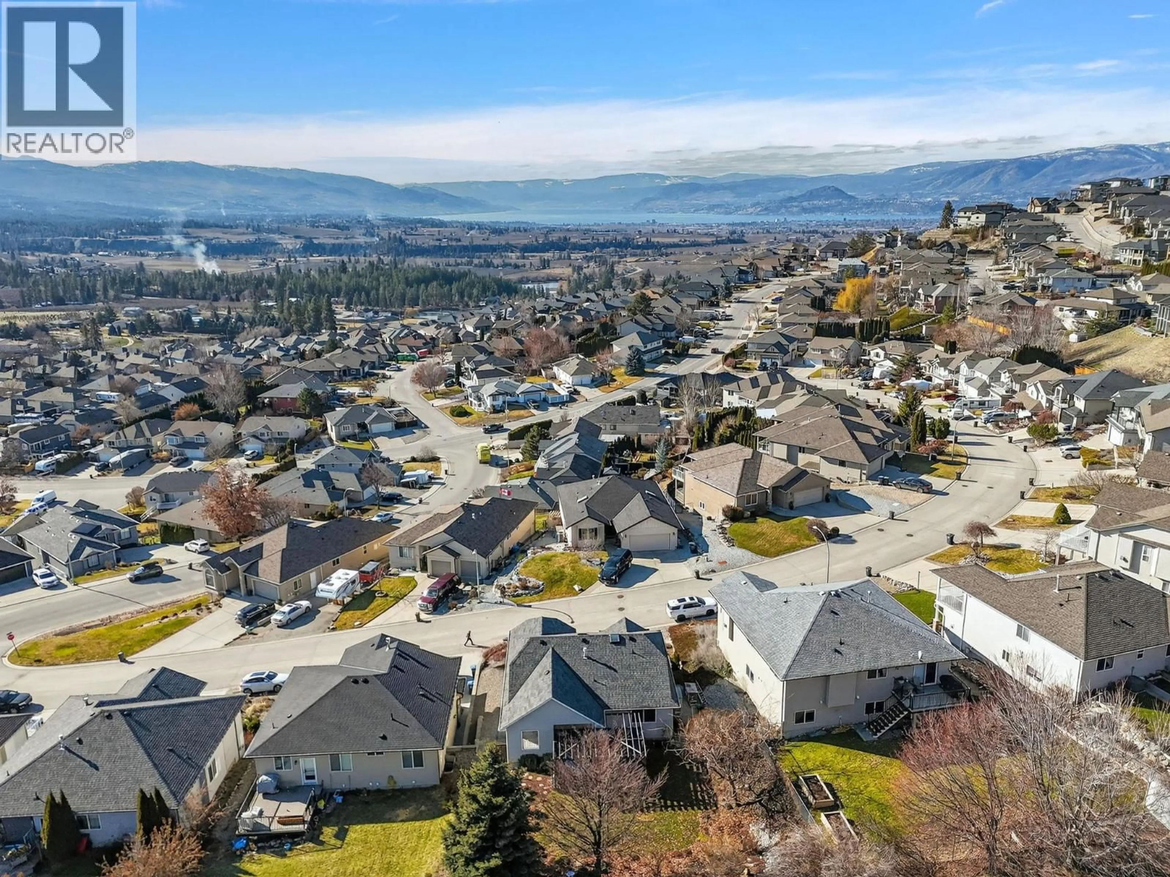 A pic from outside/outdoor area/front of a property/back of a property/a pic from drone, mountain view for 1568 LONGLEY CRESCENT, Kelowna British Columbia V1P1M9