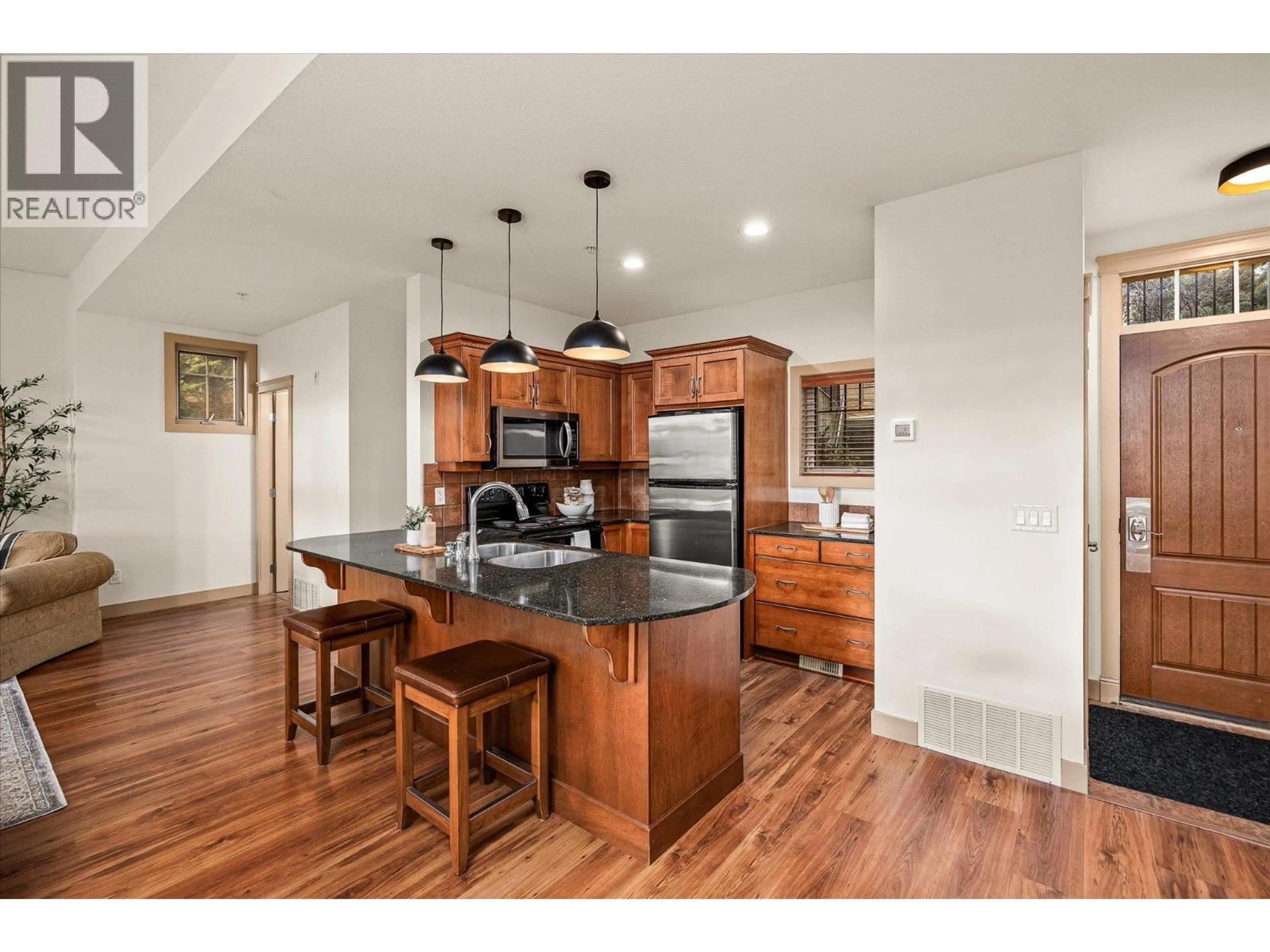 Open concept kitchen, wood/laminate floor for 126 - 1795 COUNTRY CLUB DRIVE, Kelowna British Columbia V1V3E8