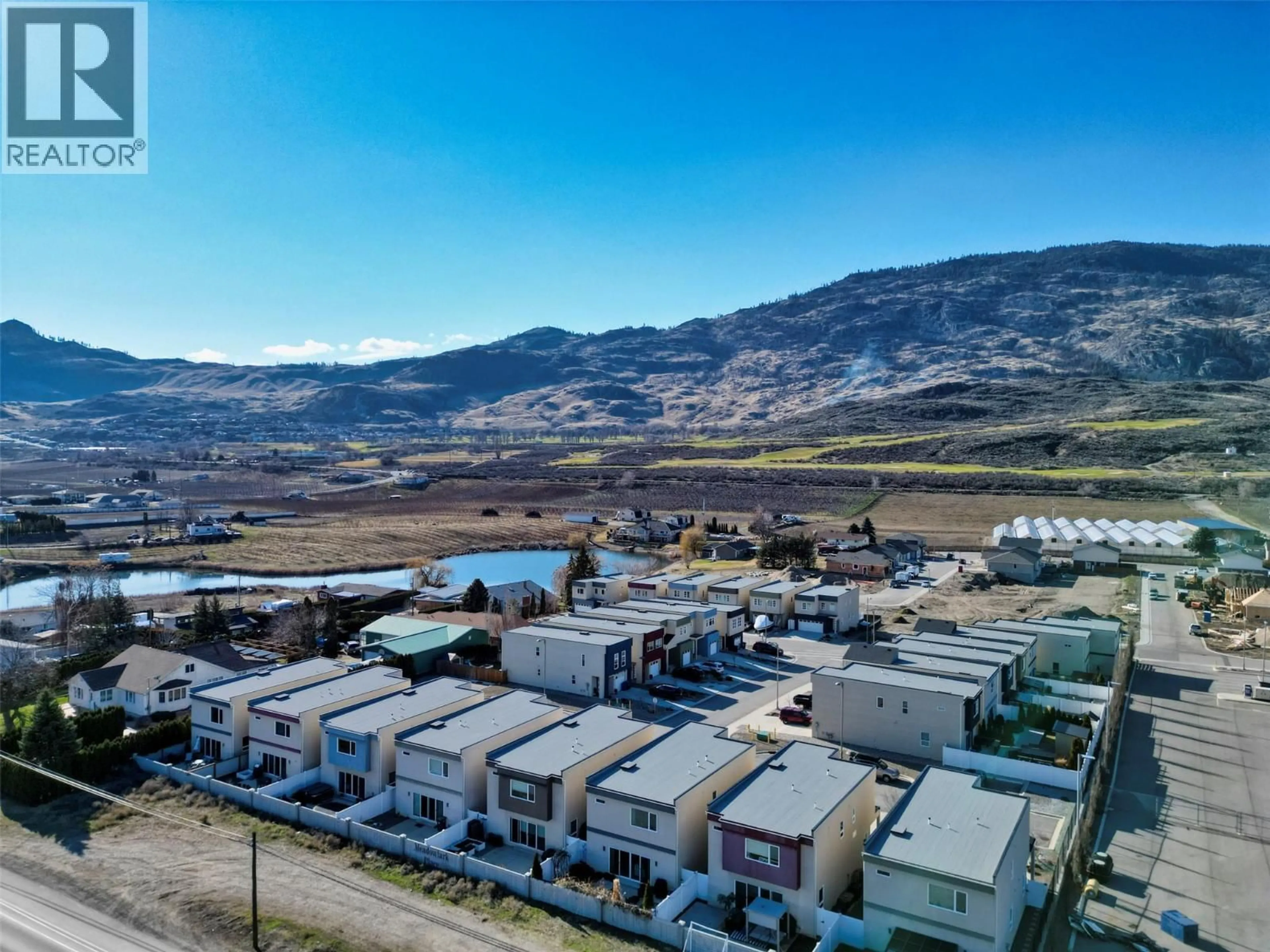 A pic from outside/outdoor area/front of a property/back of a property/a pic from drone, mountain view for 21 RAVEN COURT, Osoyoos British Columbia V0H1V5