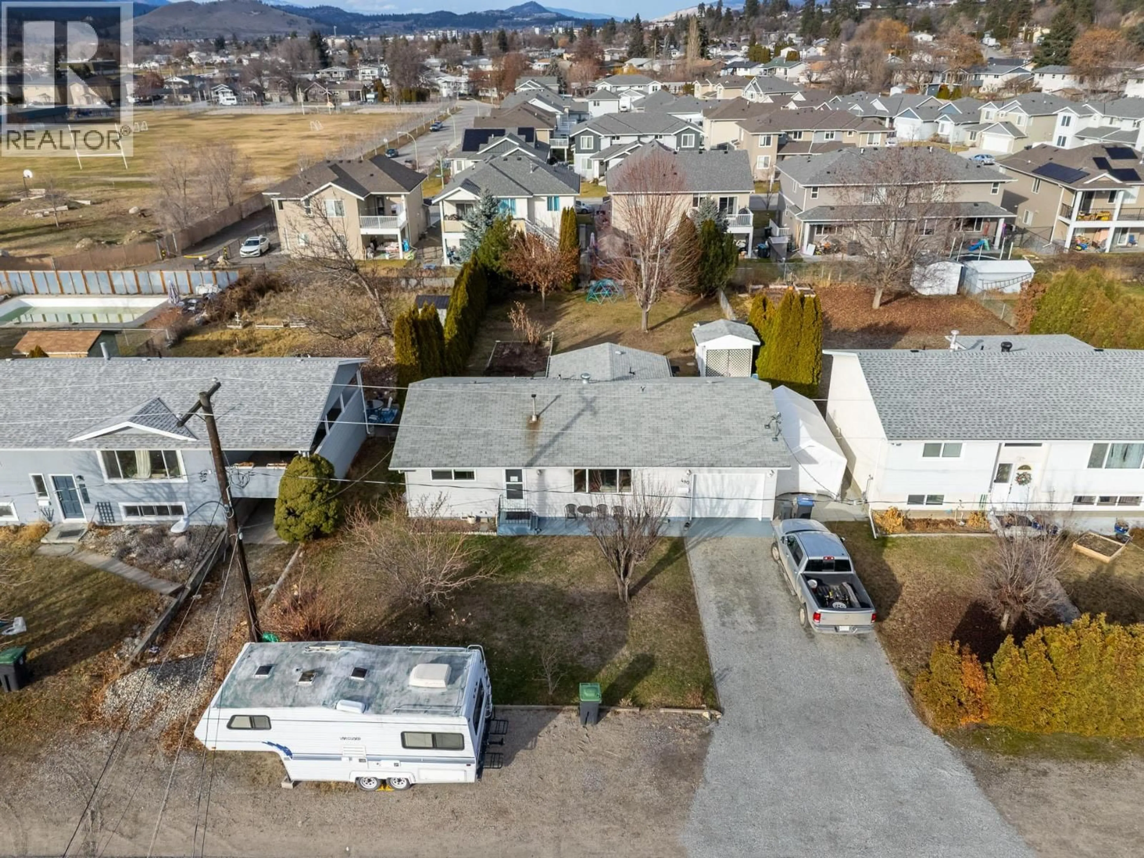 A pic from outside/outdoor area/front of a property/back of a property/a pic from drone, street for 480 MONTEREY ROAD, Kelowna British Columbia V1X1A2