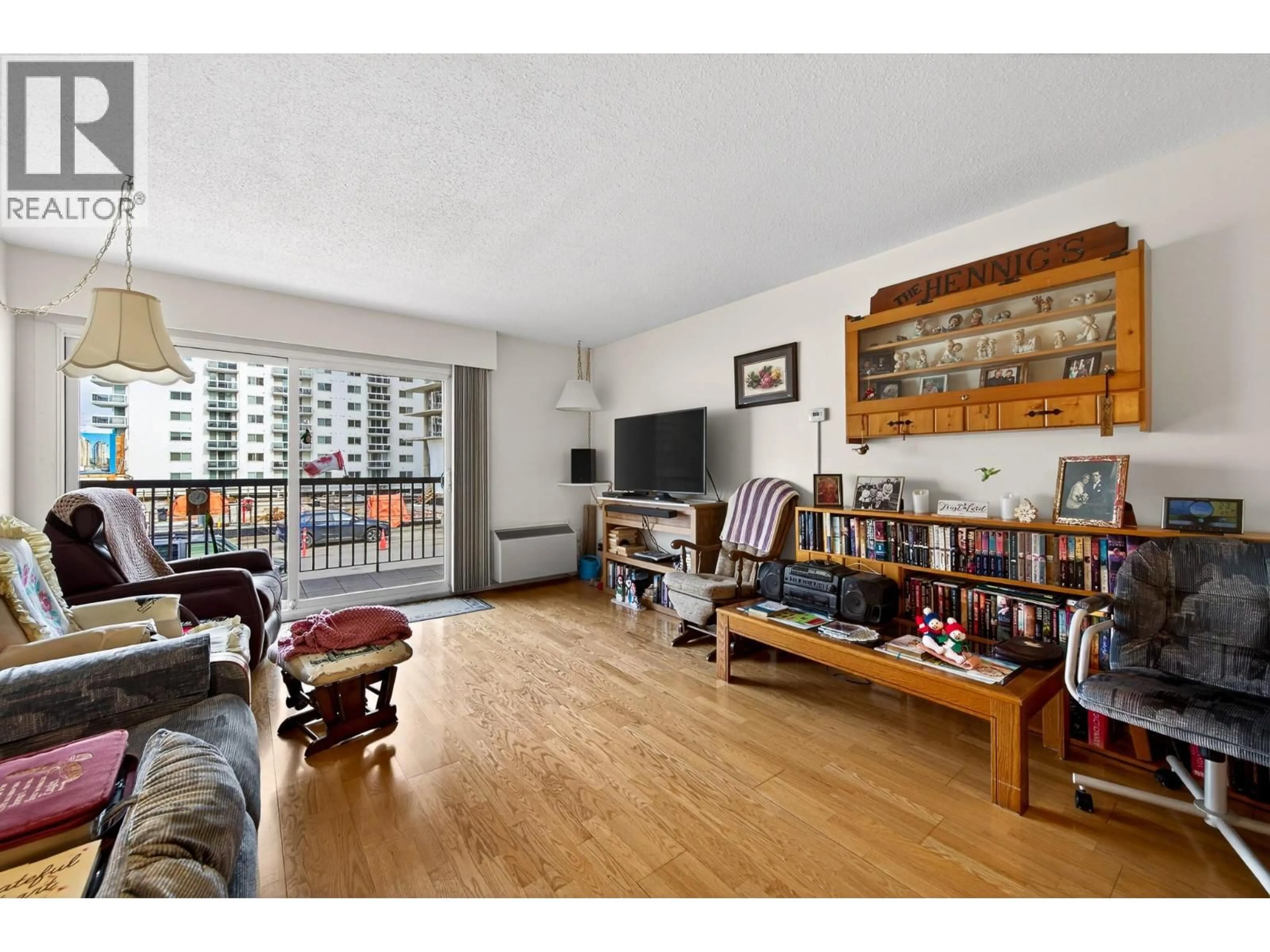 Living room with furniture, wood/laminate floor for 104 - 411 NICOLA STREET, Kamloops British Columbia V2C2P7