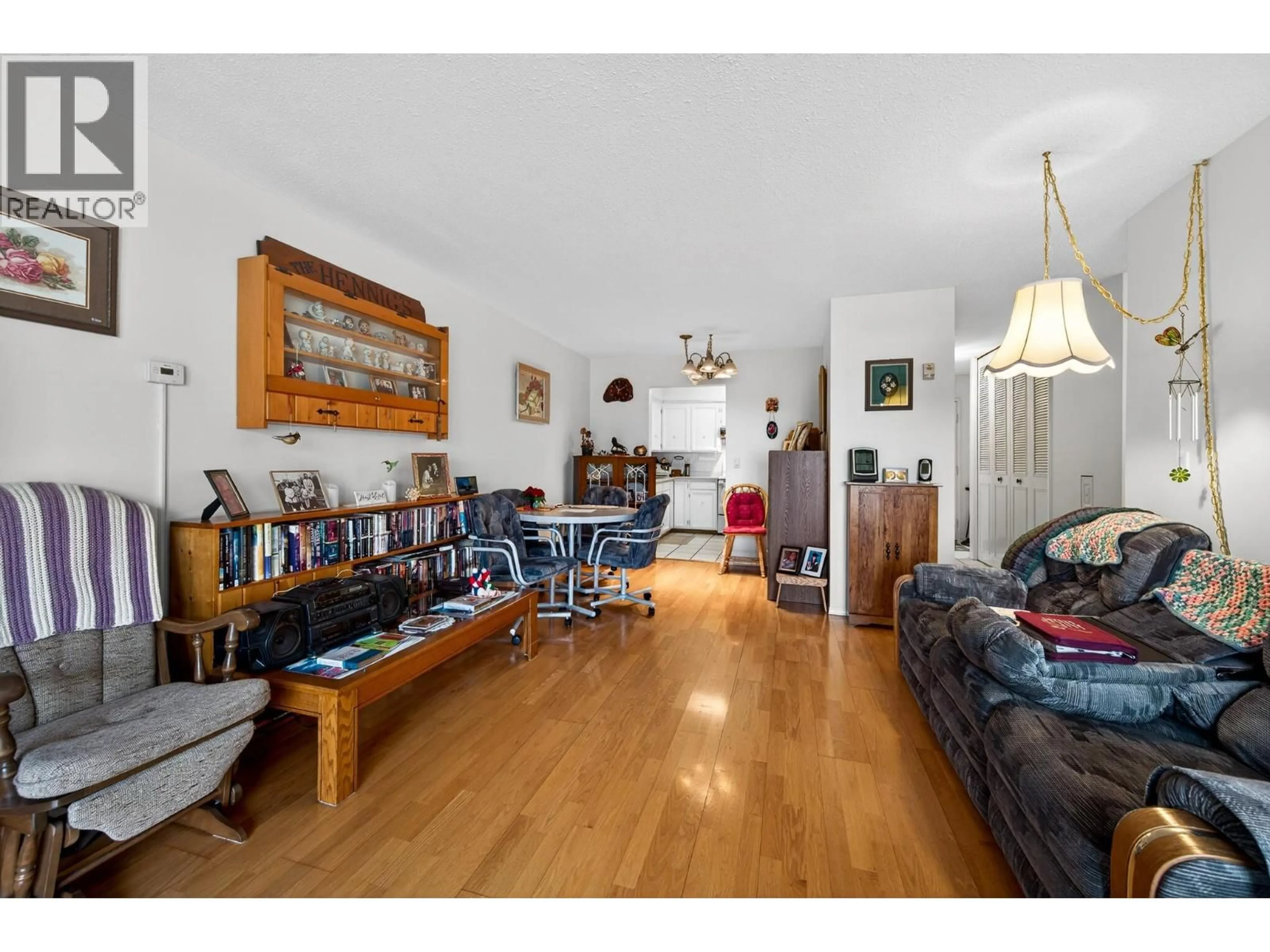 Living room with furniture, wood/laminate floor for 104 - 411 NICOLA STREET, Kamloops British Columbia V2C2P7