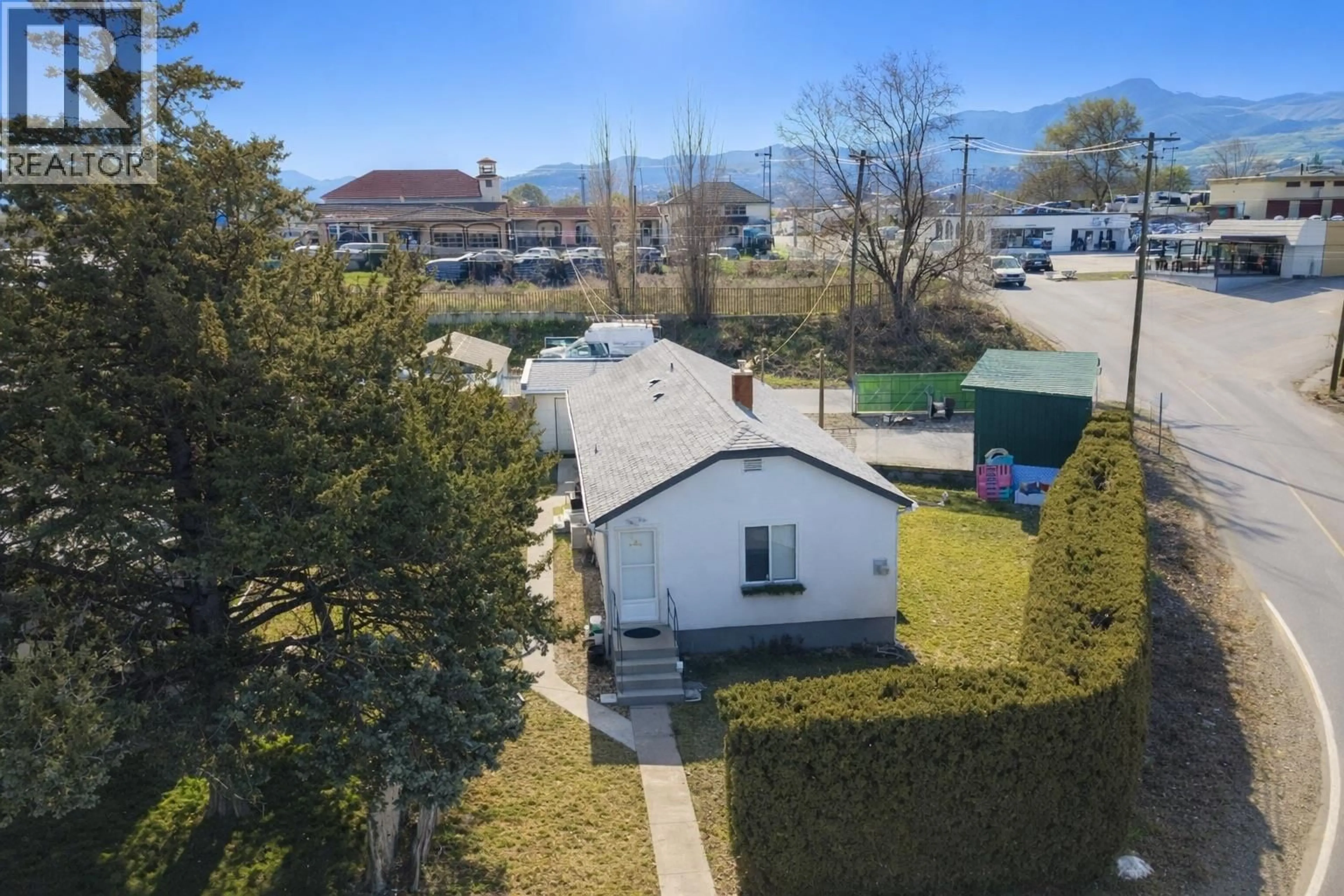 A pic from outside/outdoor area/front of a property/back of a property/a pic from drone, street for 8711 78TH AVENUE, Osoyoos British Columbia V0H1V0