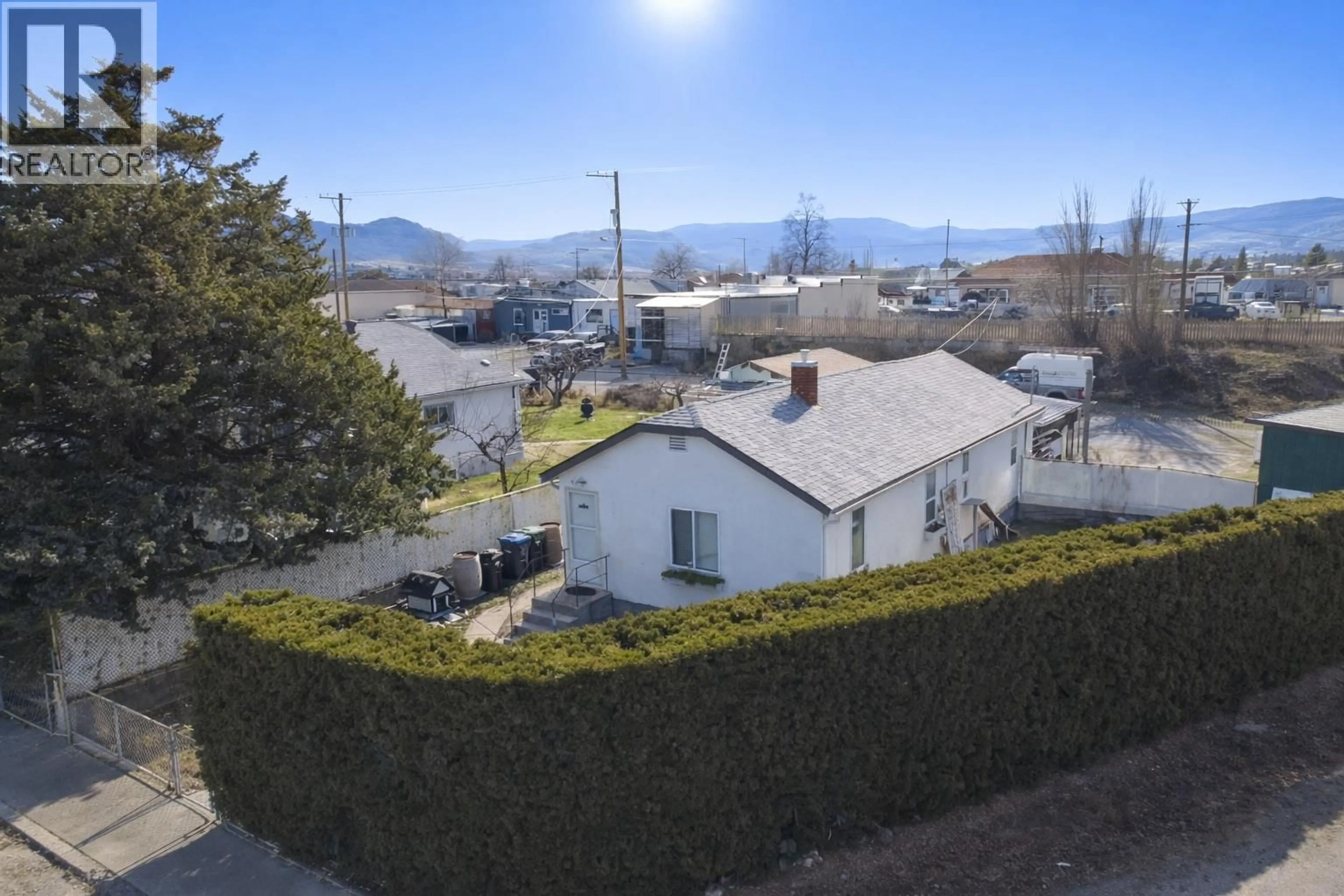 A pic from outside/outdoor area/front of a property/back of a property/a pic from drone, mountain view for 8711 78TH AVENUE, Osoyoos British Columbia V0H1V0