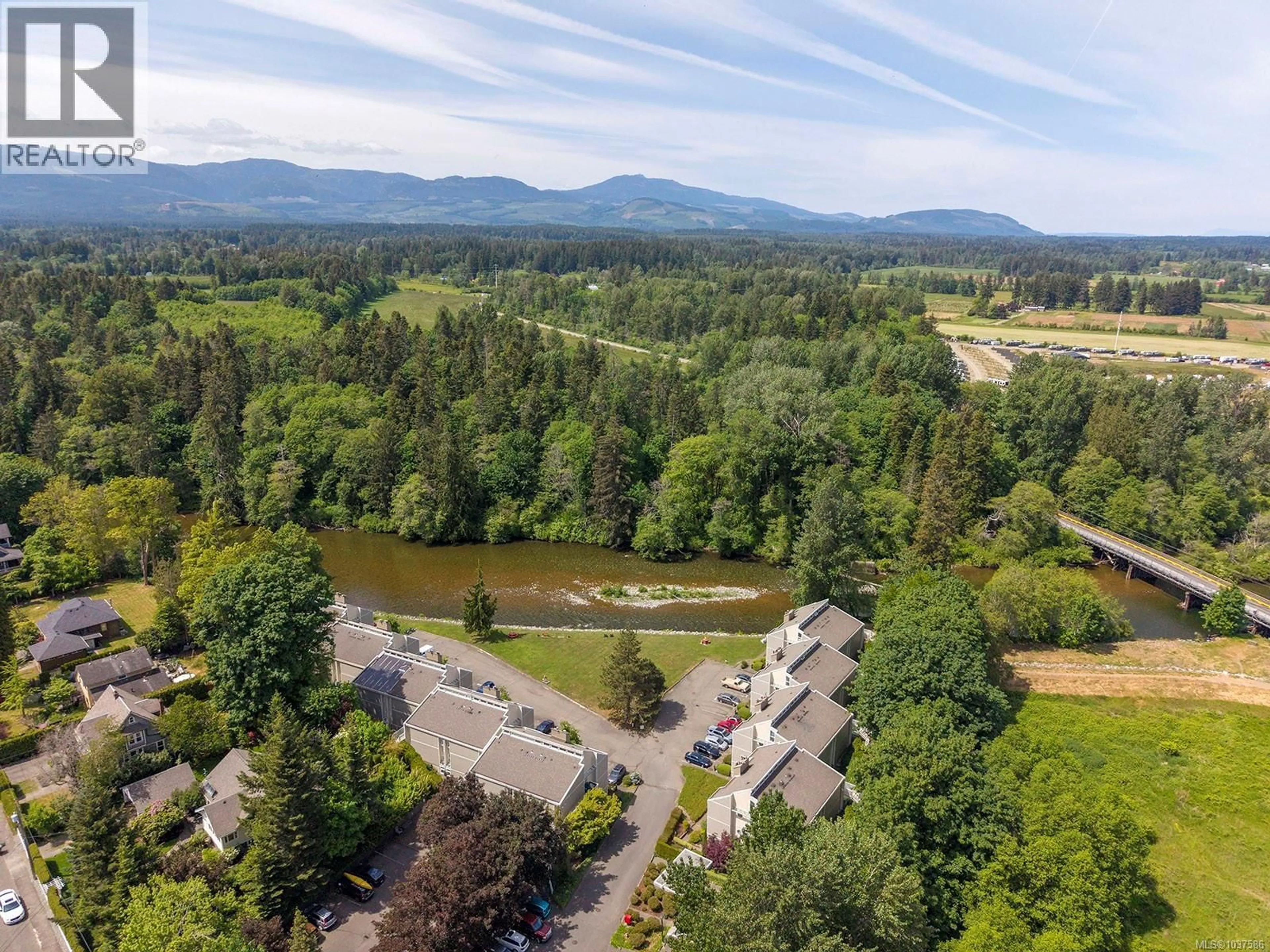 A pic from outside/outdoor area/front of a property/back of a property/a pic from drone, water/lake/river/ocean view for 315 - 205 1ST STREET, Courtenay British Columbia V9N1A5