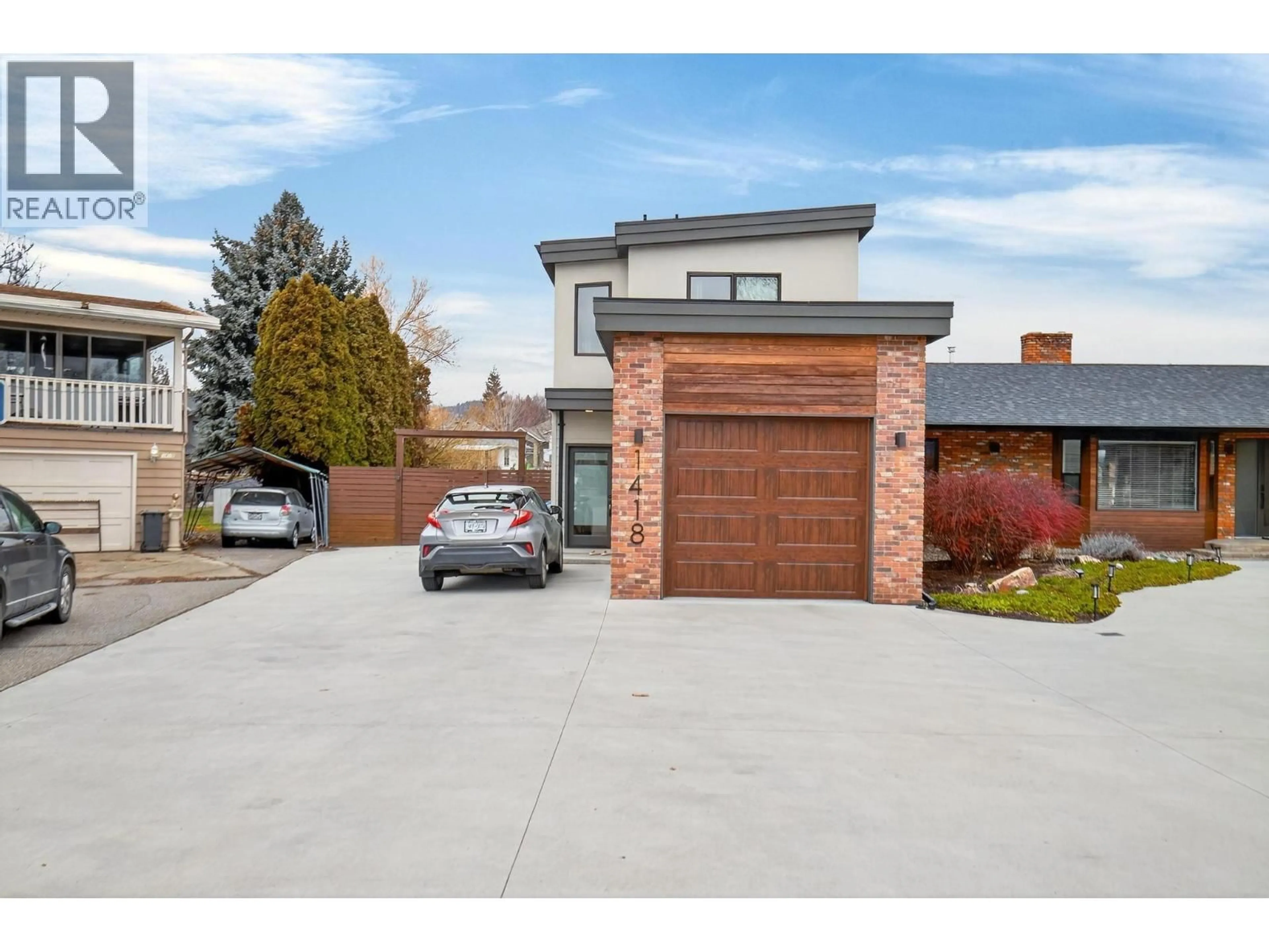 Home with brick exterior material, street for 1418/1420 INKAR ROAD, Kelowna British Columbia V1Y8A7