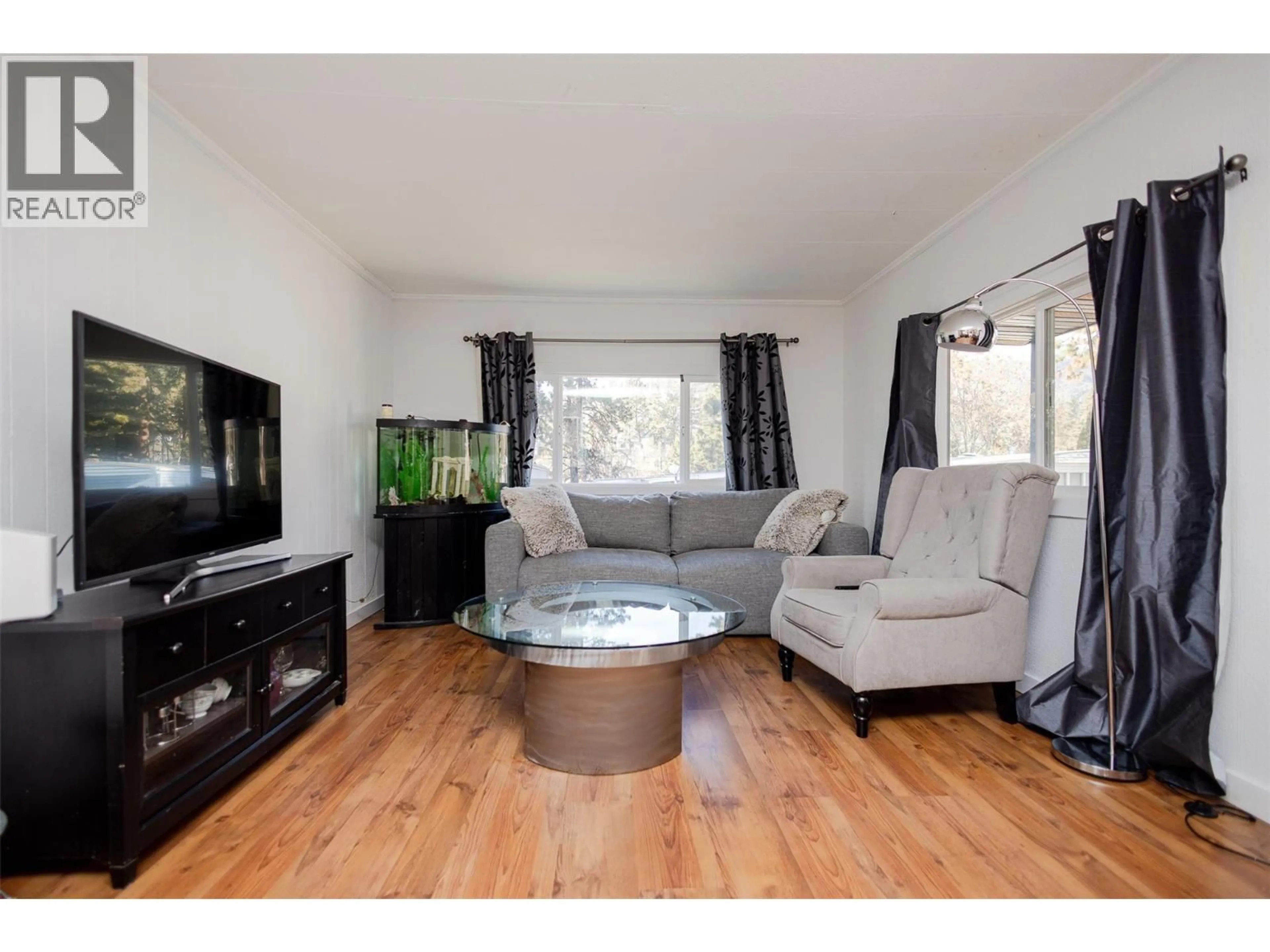 Living room with furniture, wood/laminate floor for 133 - 1999 HIGHWAY 97 OTHER SOUTH, West Kelowna British Columbia V1Z1B2