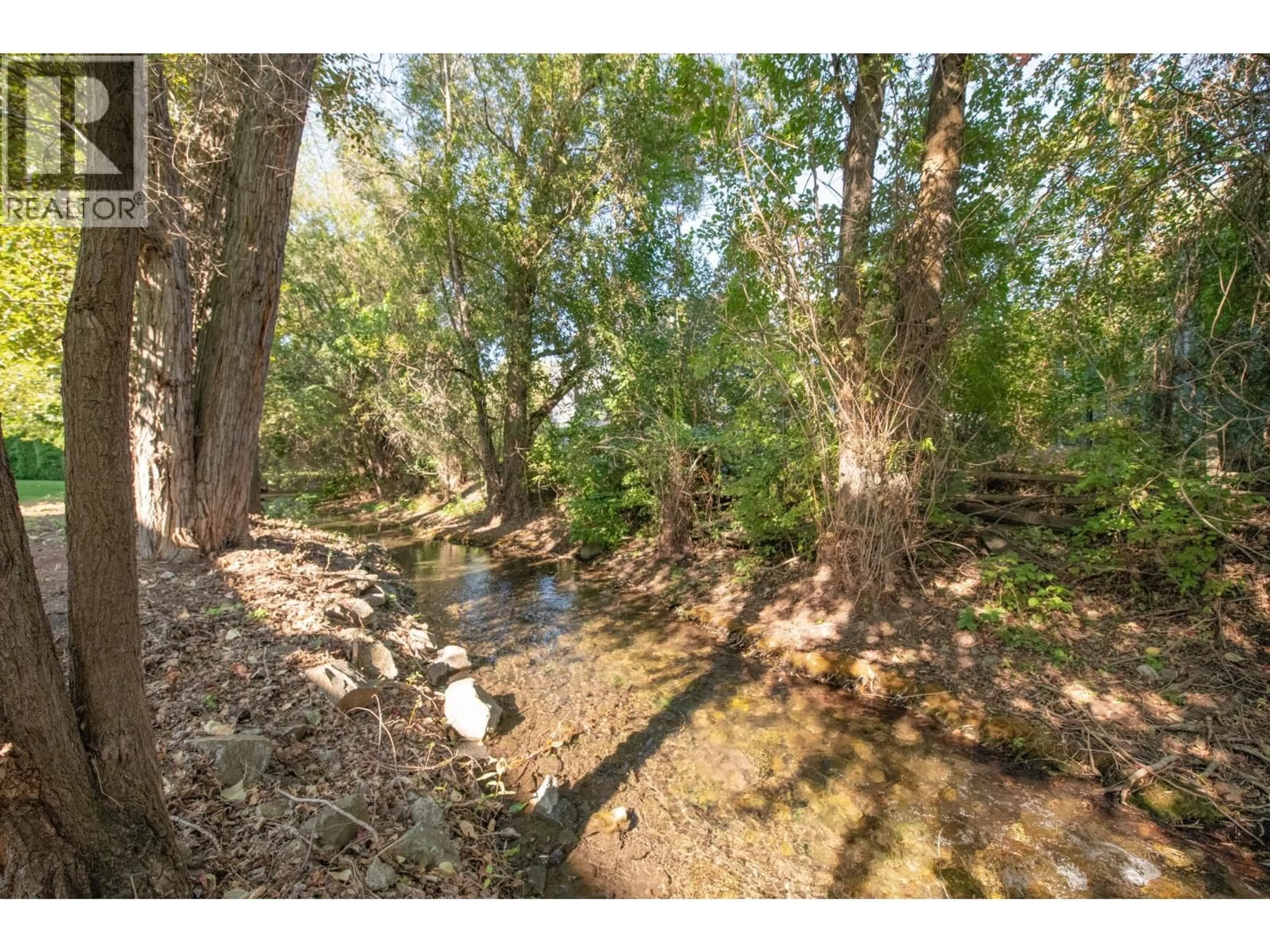 A pic from outside/outdoor area/front of a property/back of a property/a pic from drone, forest/trees view for 107 - 110 KALAMALKA LAKE ROAD, Vernon British Columbia V1T7M3