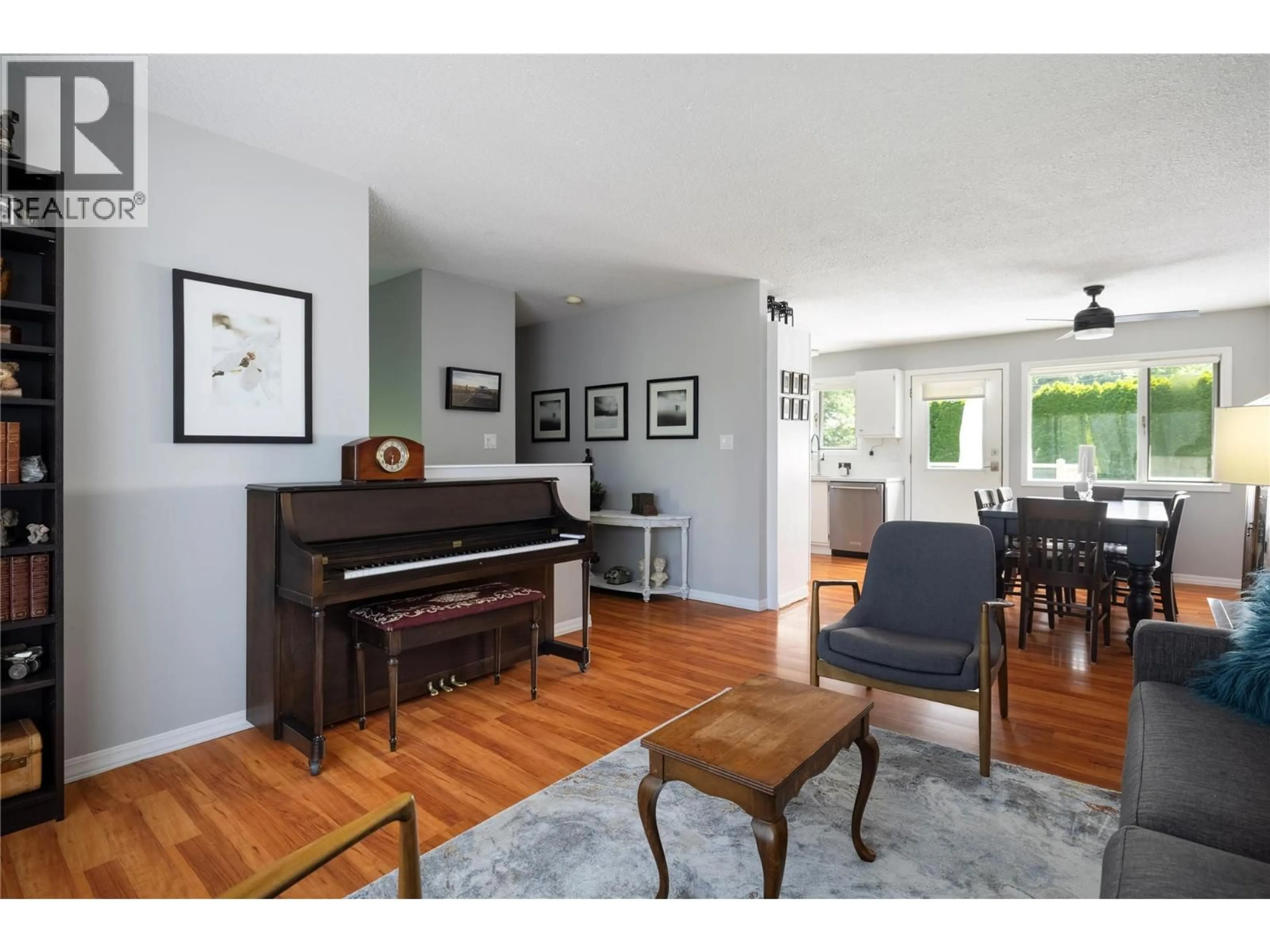 Living room with furniture, wood/laminate floor for 3429 LARCH DRIVE, Spallumcheen British Columbia V4Y0S8