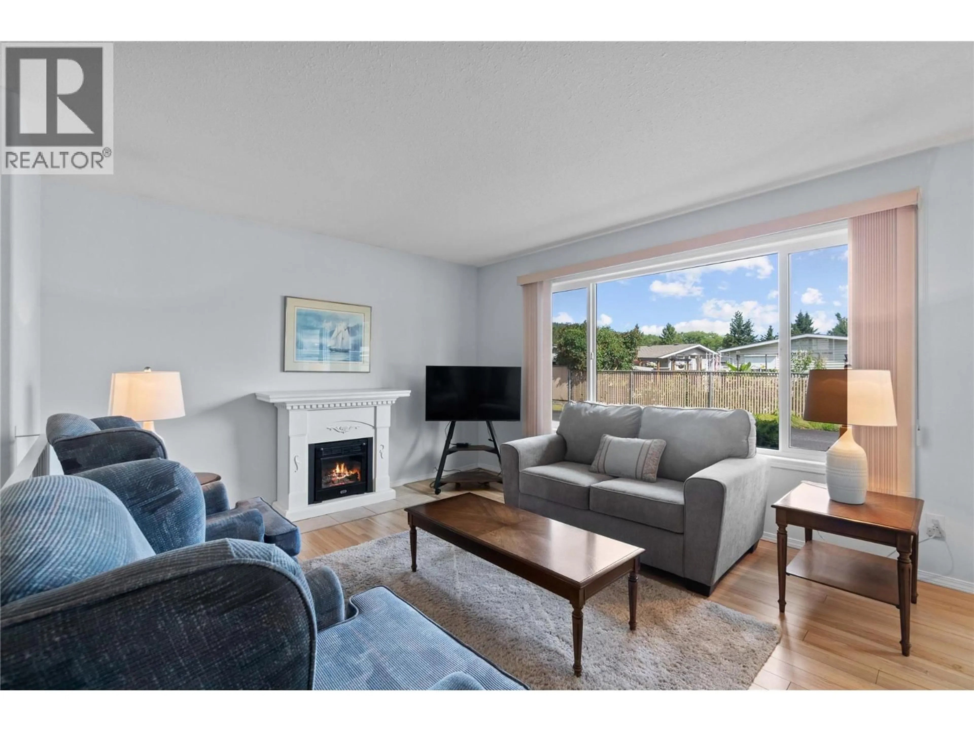 Living room with furniture, wood/laminate floor for 11 - 153 SALMON ARM DRIVE, Enderby British Columbia V4Y6A1