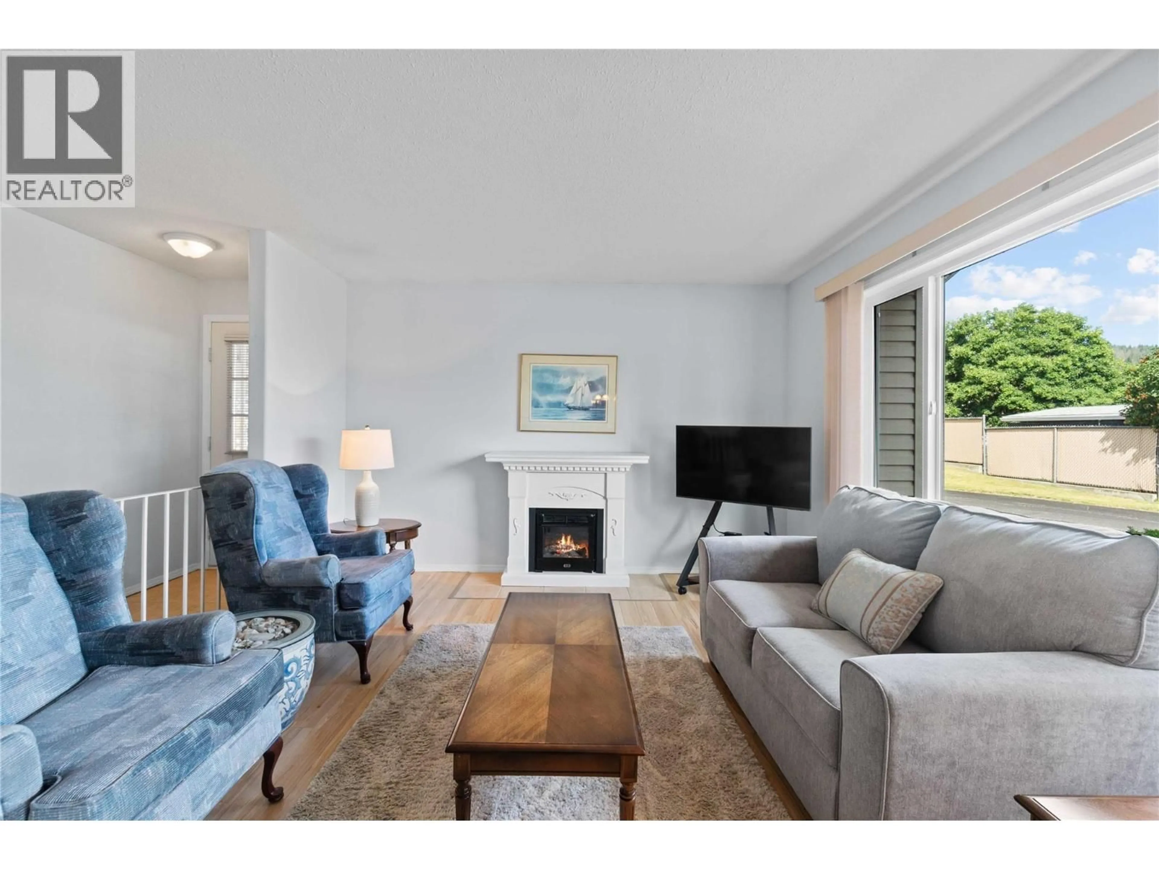 Living room with furniture, wood/laminate floor for 11 - 153 SALMON ARM DRIVE, Enderby British Columbia V4Y6A1