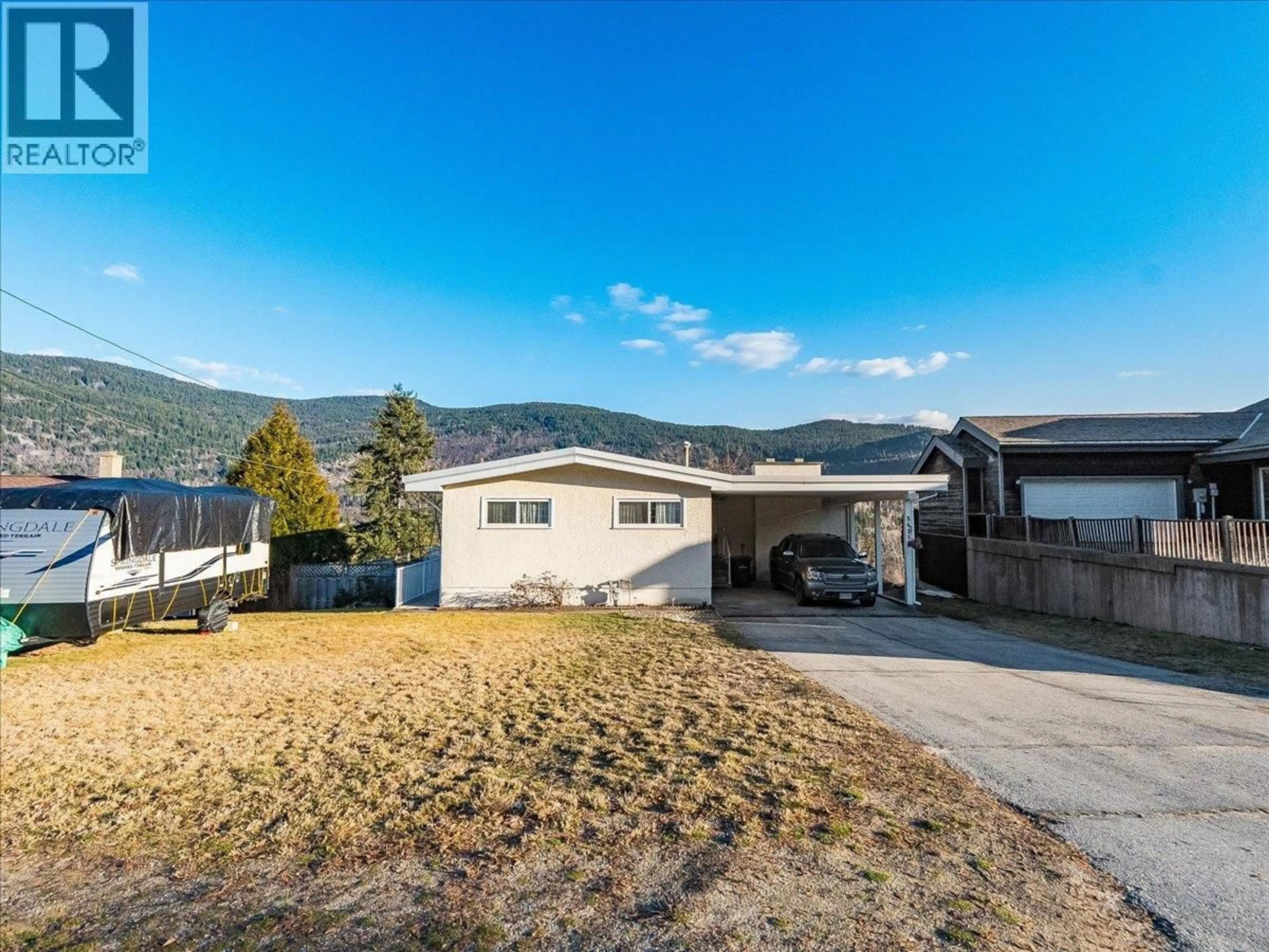 A pic from outside/outdoor area/front of a property/back of a property/a pic from drone, mountain view for 3613 9TH AVENUE, Castlegar British Columbia V1N2Z6