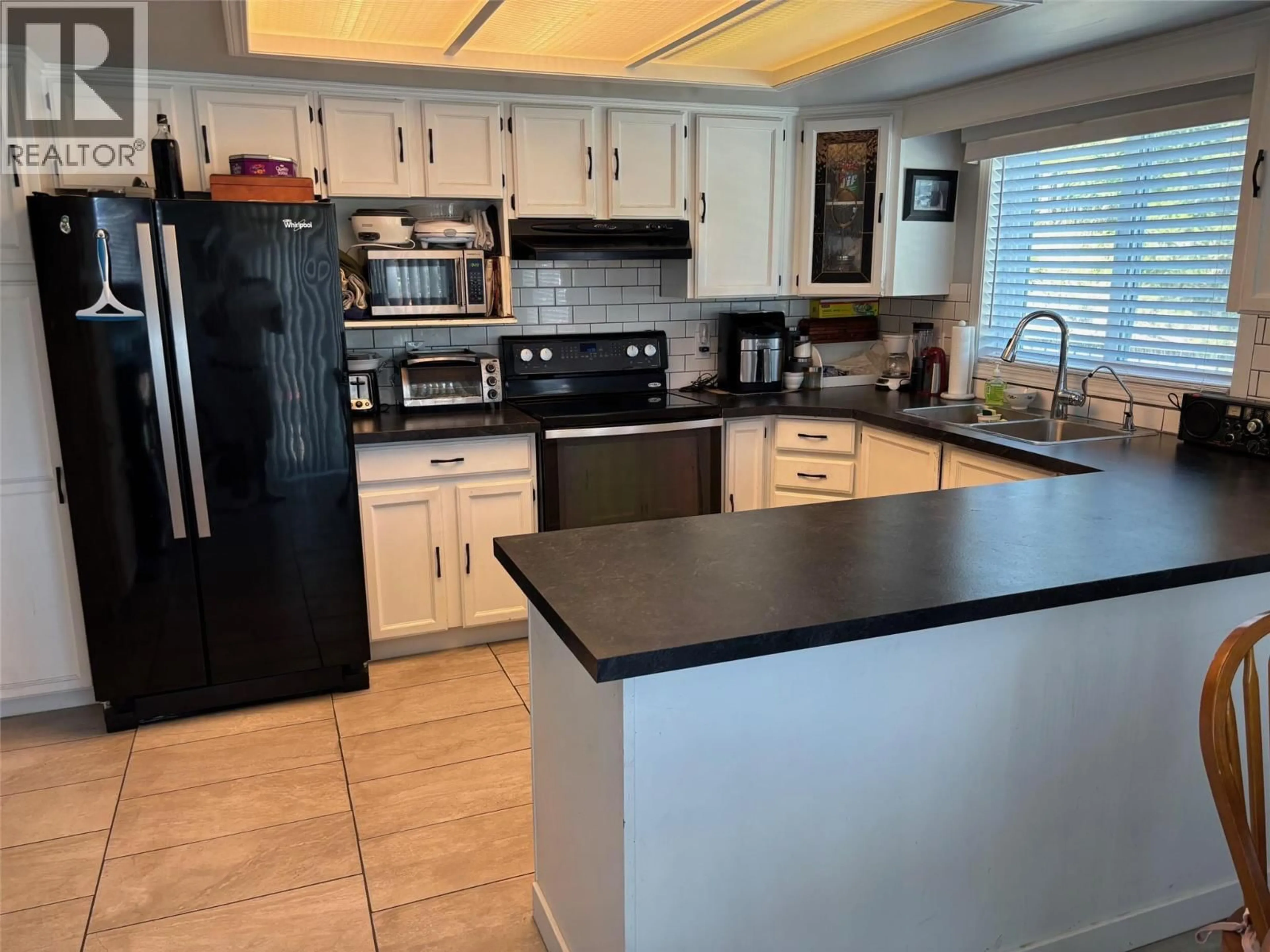 Open concept kitchen, ceramic/tile floor for 1820 OLYMPUS WAY, West Kelowna British Columbia V1Z3J1