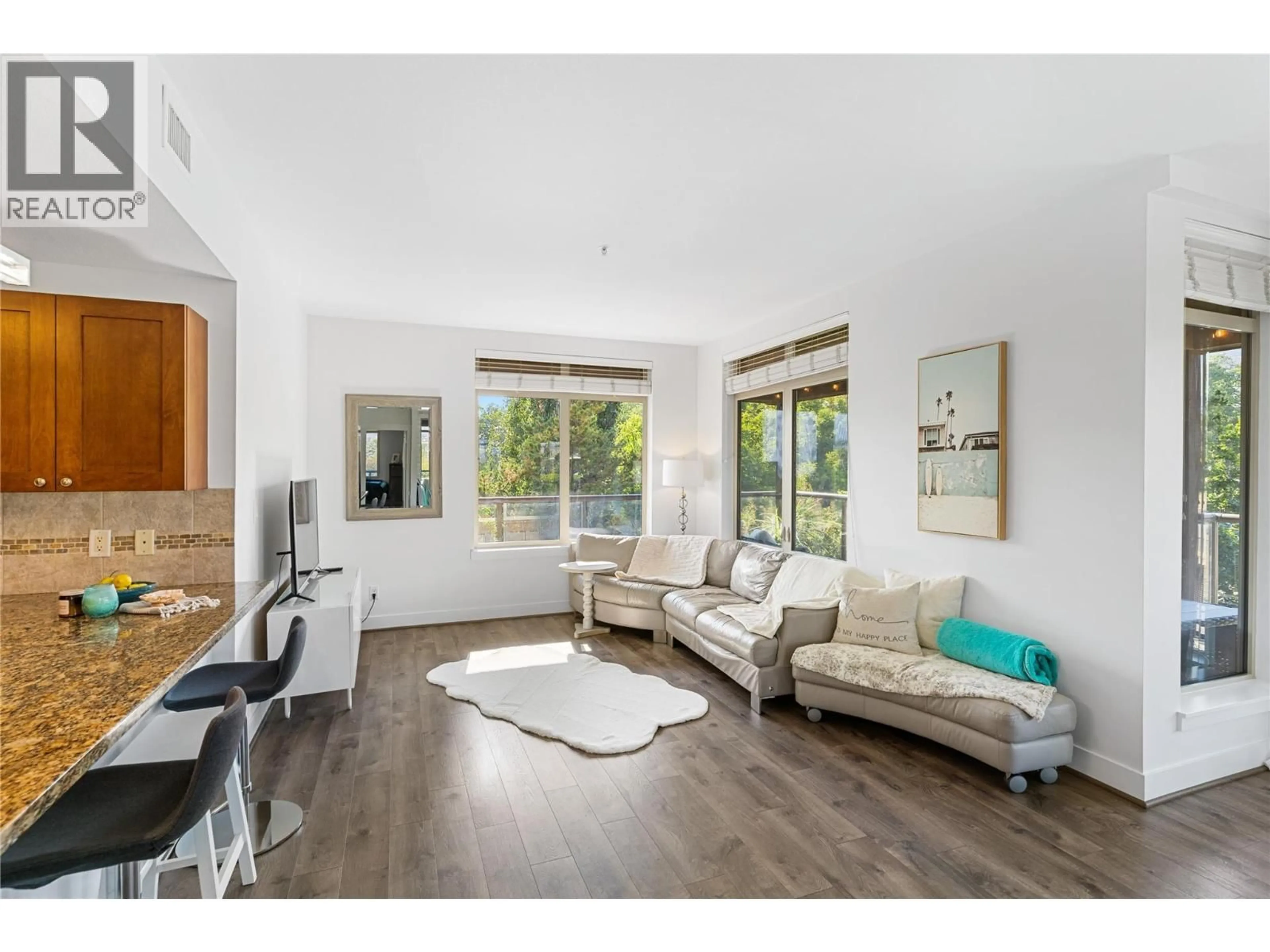 Living room with furniture, wood/laminate floor for 238 - 4205 GELLATLY ROAD, West Kelowna British Columbia V4T2K2