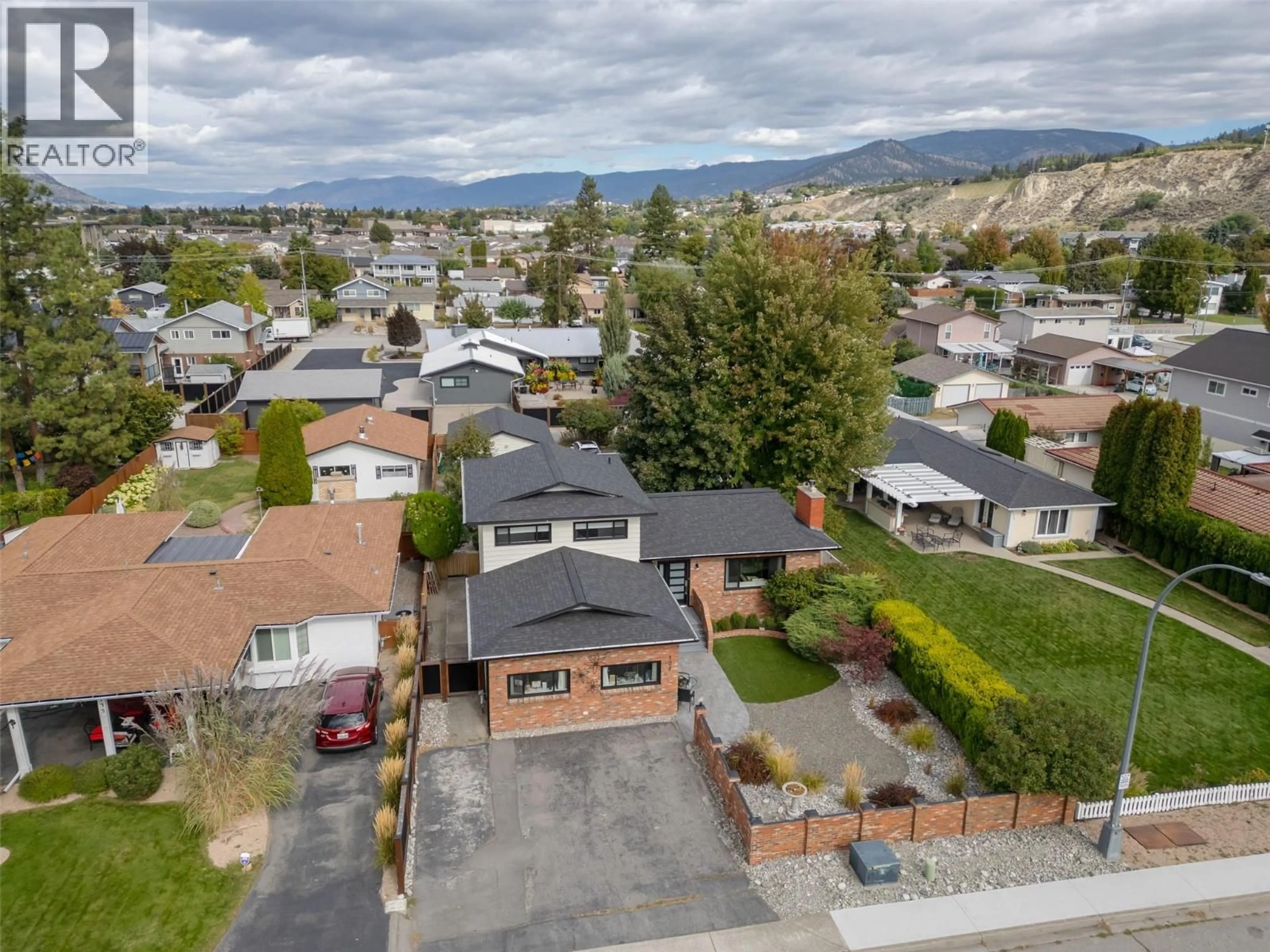 A pic from outside/outdoor area/front of a property/back of a property/a pic from drone, mountain view for 127 ELM AVENUE, Penticton British Columbia V2A3W1