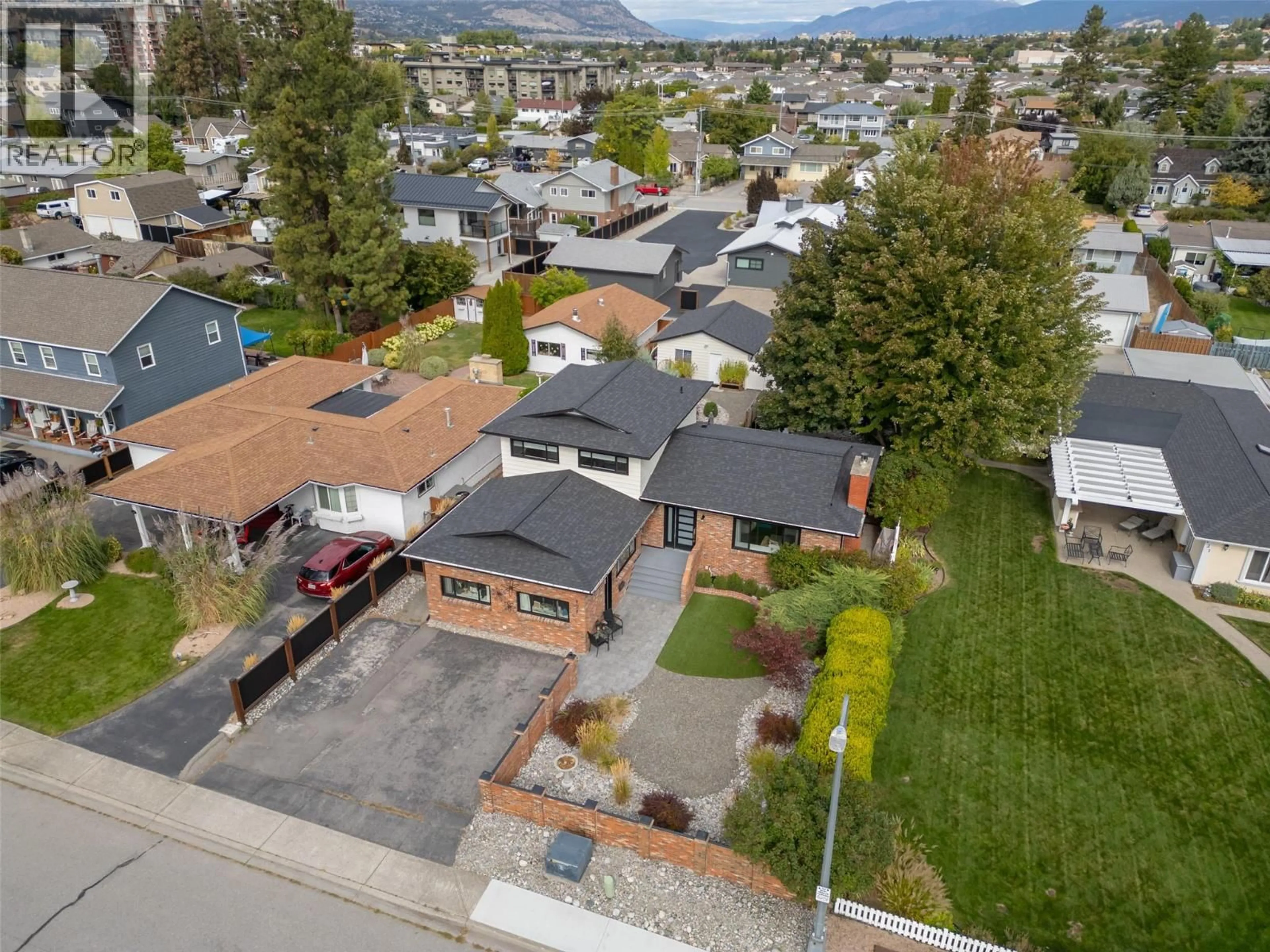 A pic from outside/outdoor area/front of a property/back of a property/a pic from drone, street for 127 ELM AVENUE, Penticton British Columbia V2A3W1