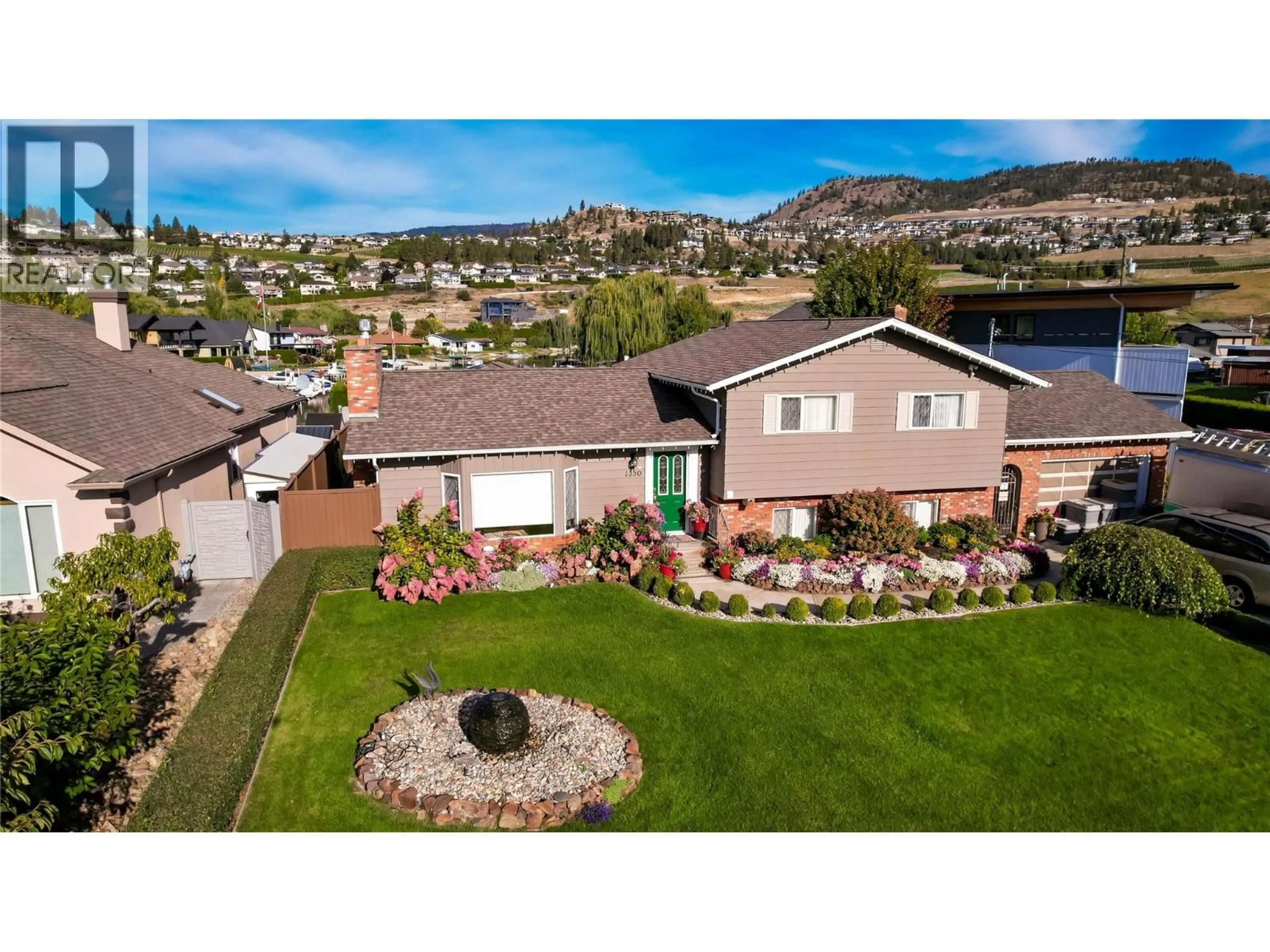 A pic from outside/outdoor area/front of a property/back of a property/a pic from drone, mountain view for 1350 GREEN BAY ROAD, West Kelowna British Columbia V4T2B6