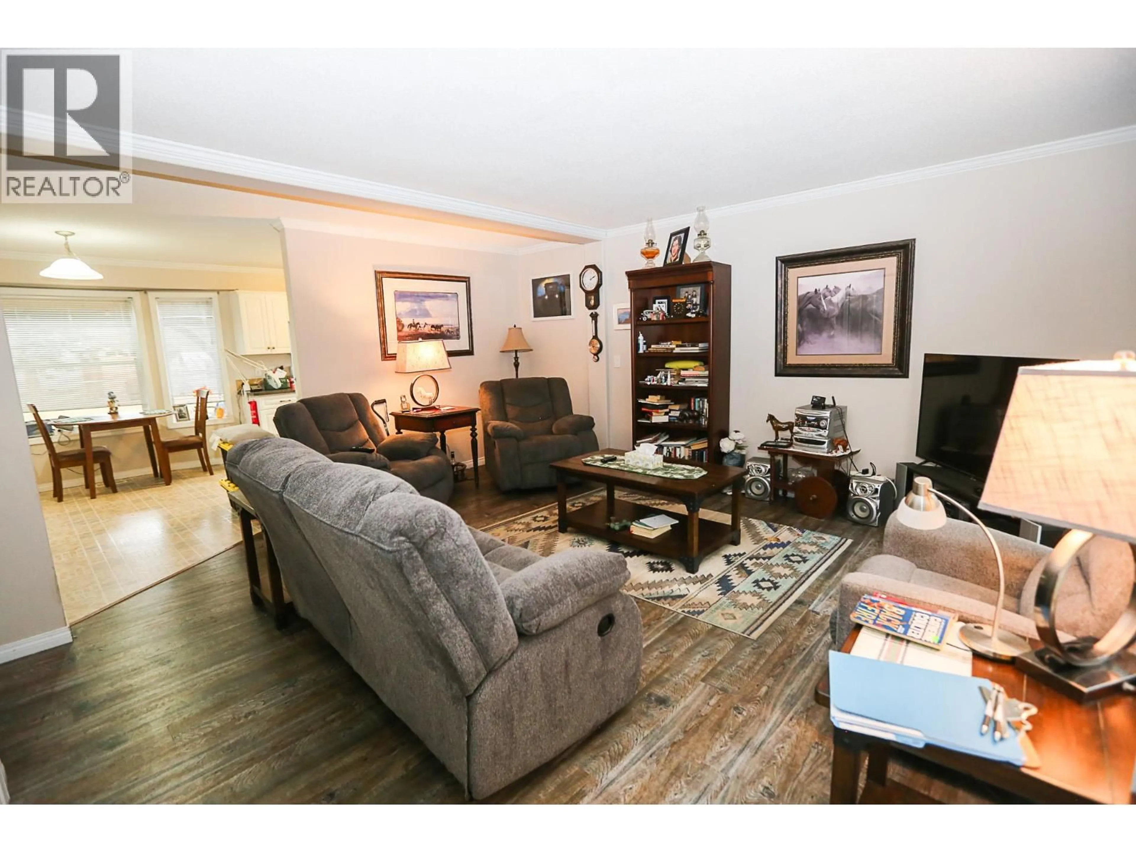 Living room with furniture, wood/laminate floor for 4820 BARRIERE TOWN ROAD, Barriere British Columbia V0E1E0