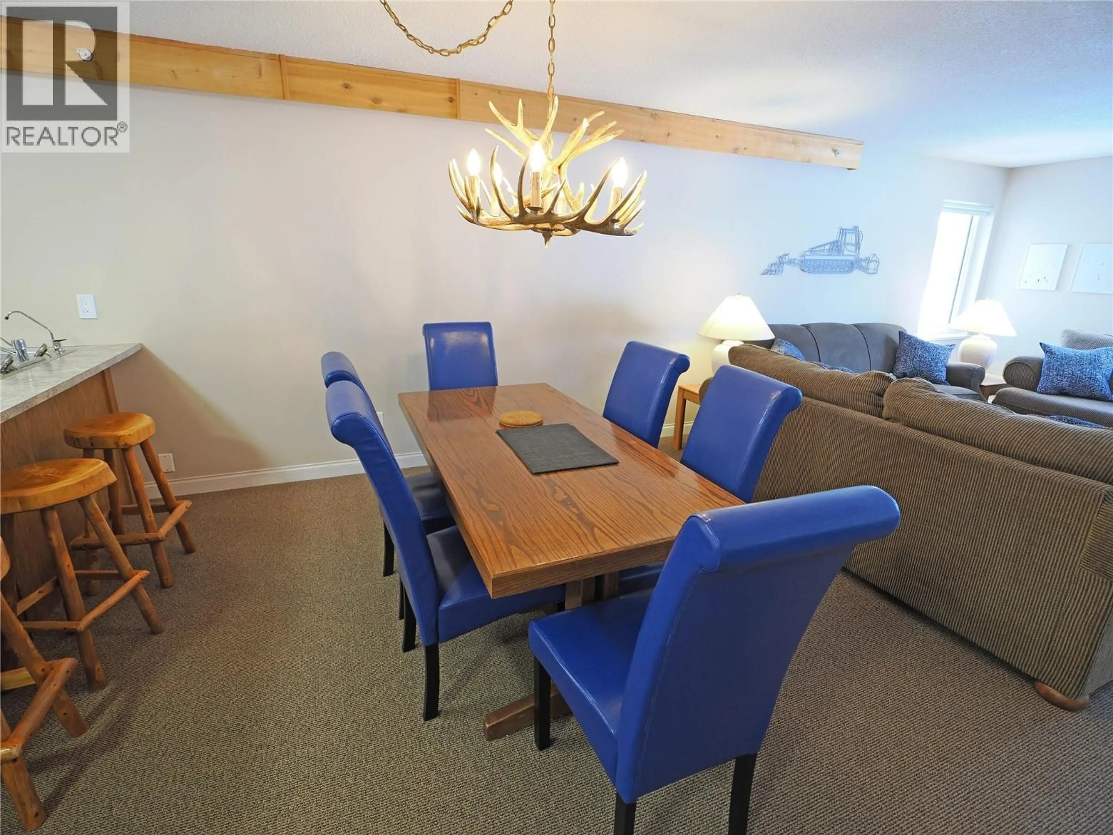 Dining room, wood/laminate floor for 209 - 5275 BIG WHITE ROAD, Big White British Columbia V1P1P3