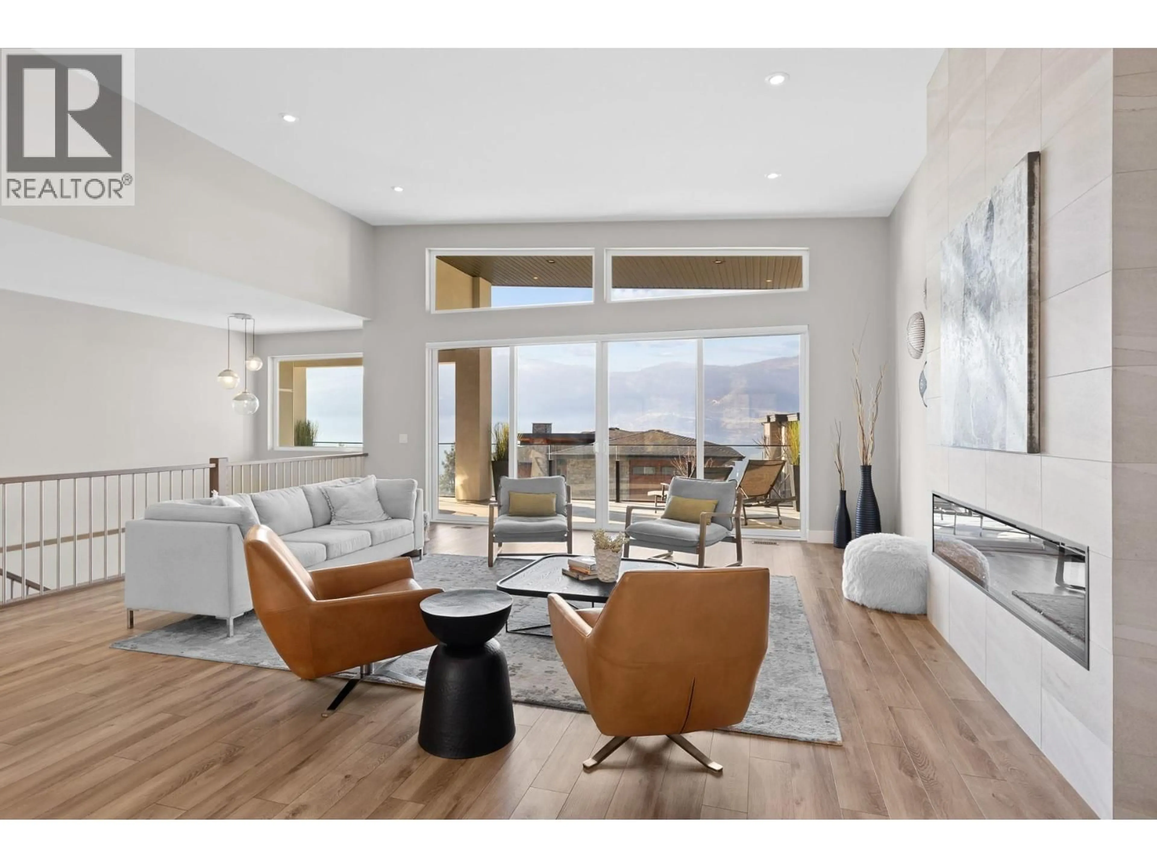 Living room with furniture, wood/laminate floor for 3605 MCKINLEY BEACH DRIVE, Kelowna British Columbia V1V3G2