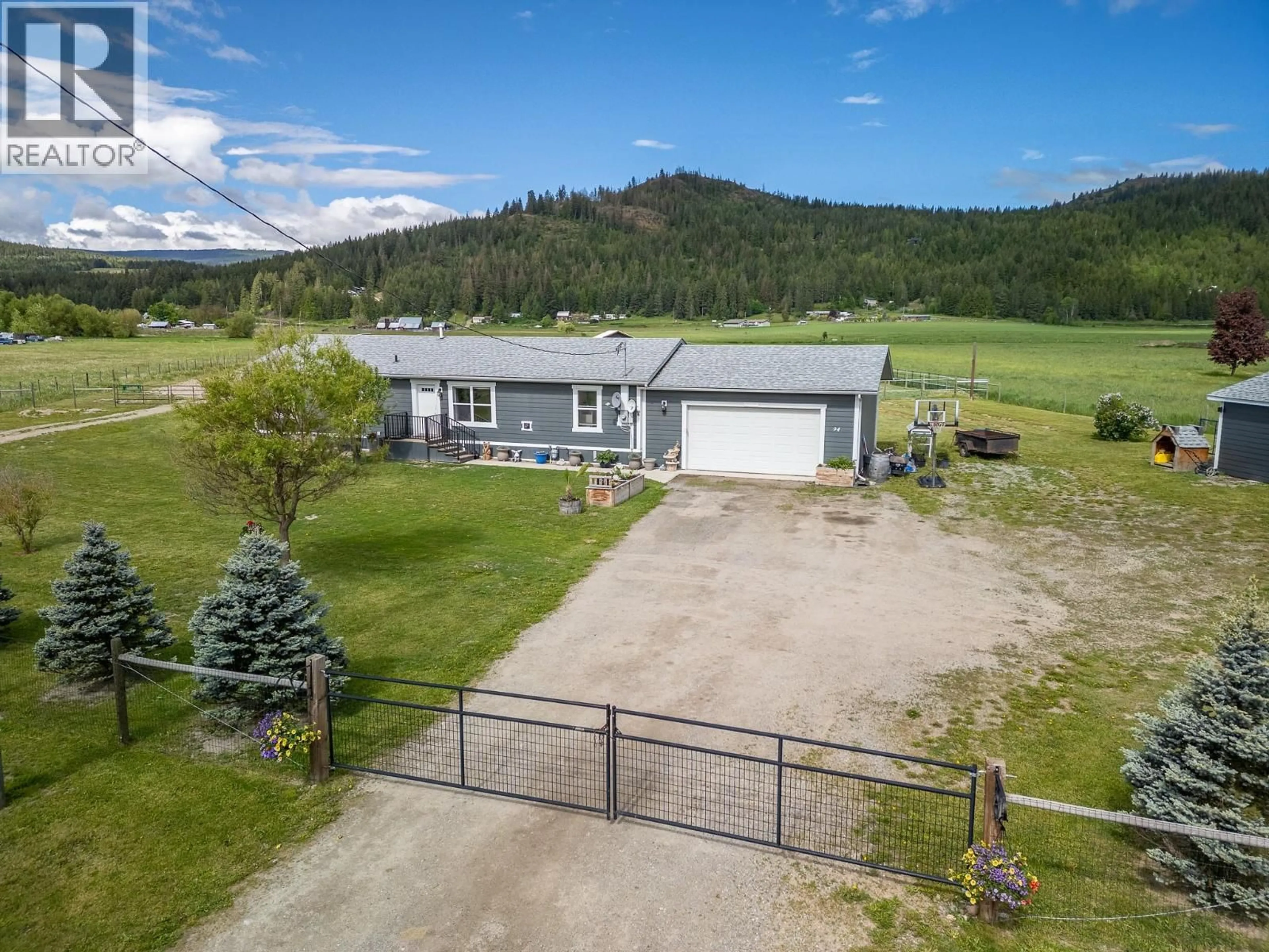 A pic from outside/outdoor area/front of a property/back of a property/a pic from drone, mountain view for 94 TOMKINSON ROAD, Grindrod British Columbia V0E1Y0