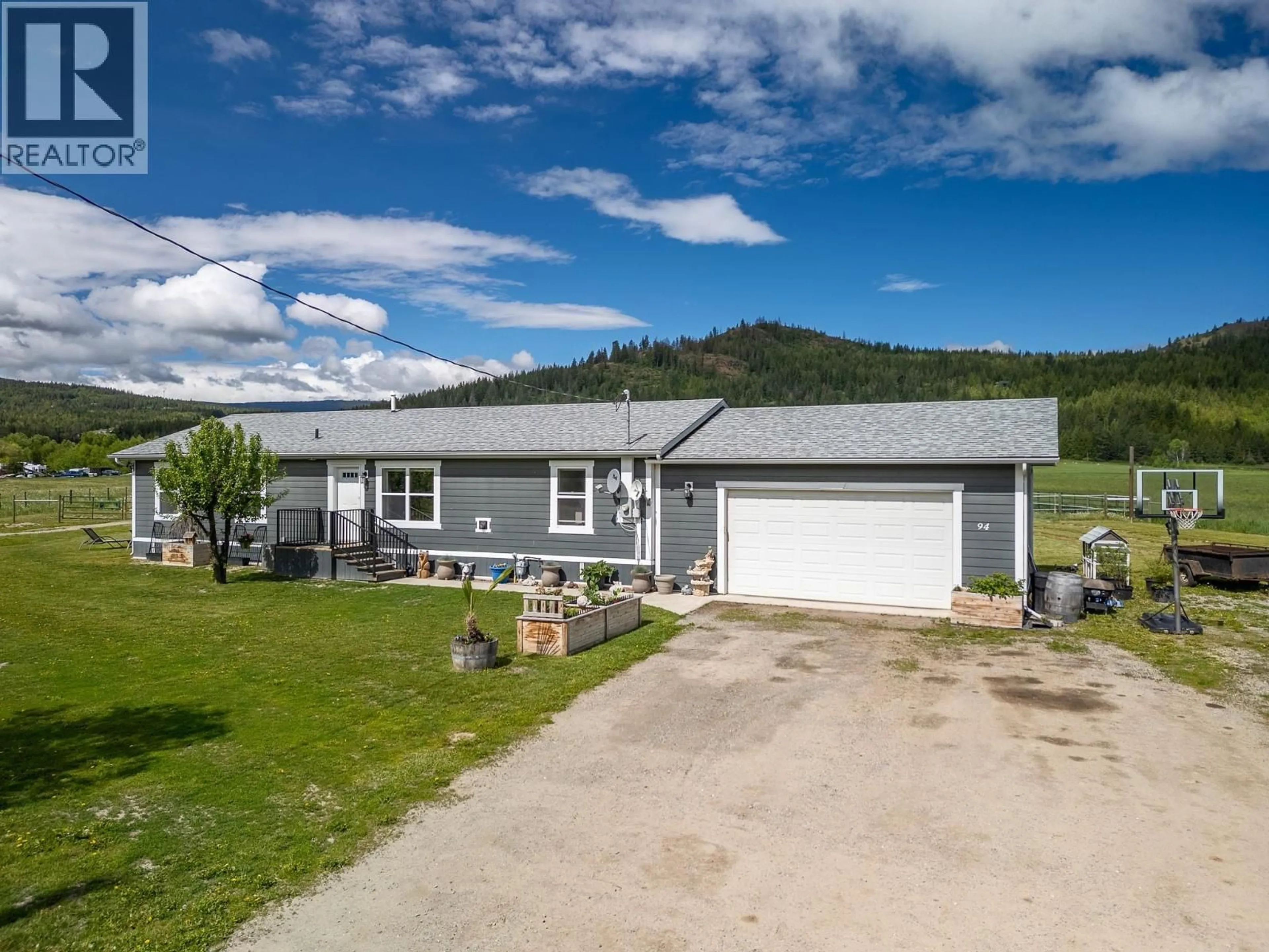 A pic from outside/outdoor area/front of a property/back of a property/a pic from drone, street for 94 TOMKINSON ROAD, Grindrod British Columbia V0E1Y0