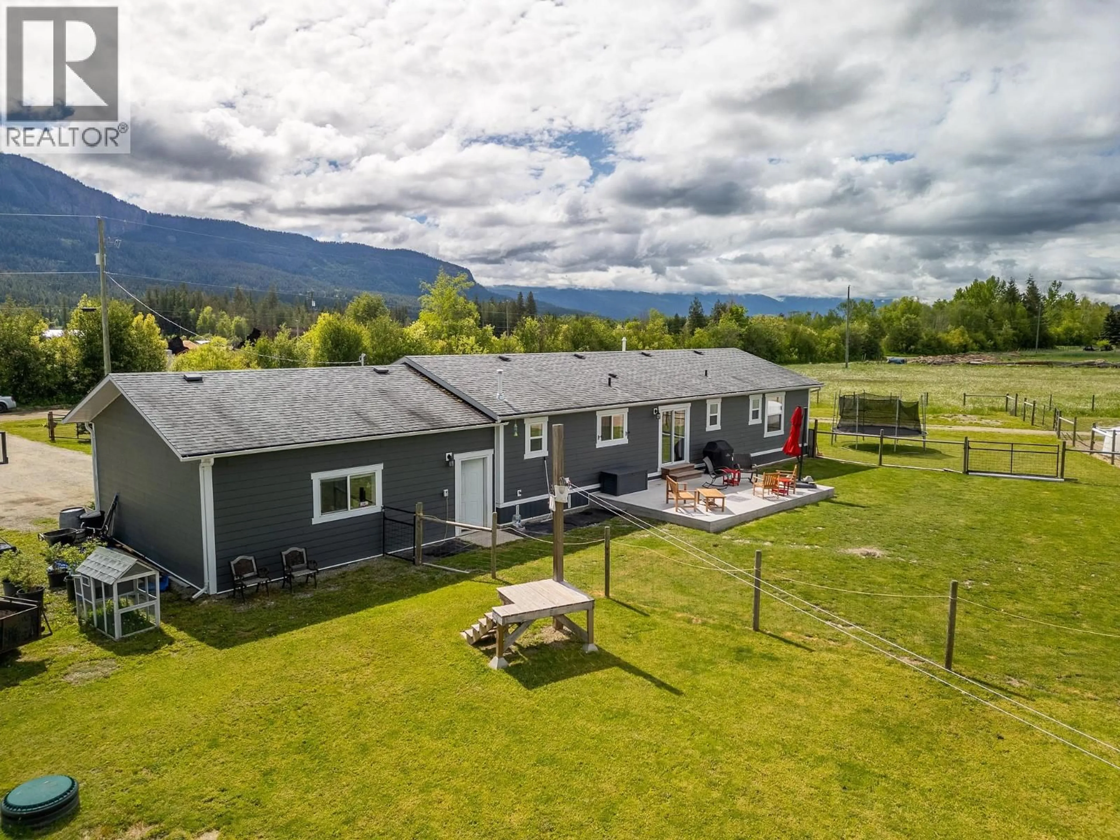 A pic from outside/outdoor area/front of a property/back of a property/a pic from drone, mountain view for 94 TOMKINSON ROAD, Grindrod British Columbia V0E1Y0