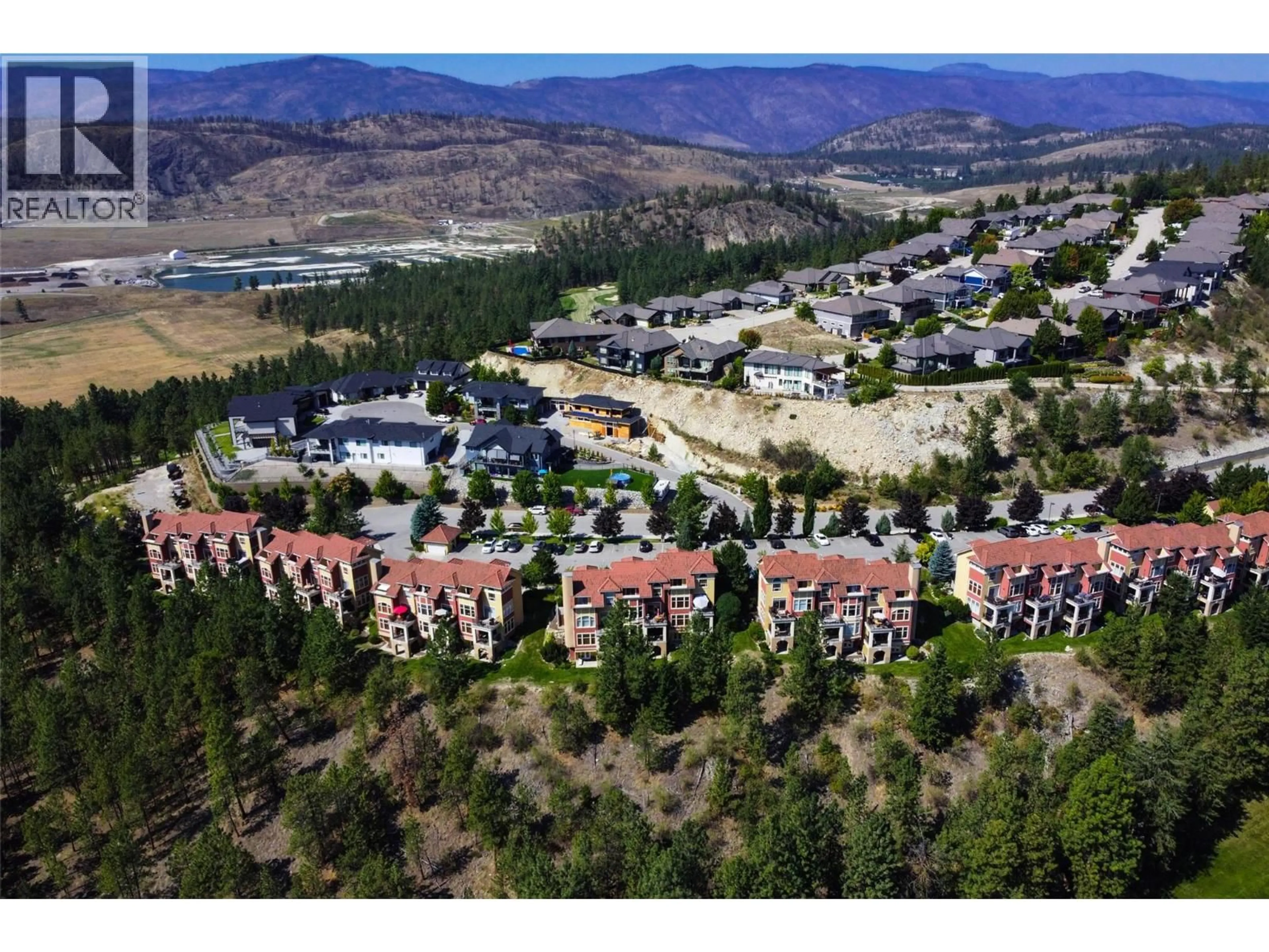 A pic from outside/outdoor area/front of a property/back of a property/a pic from drone, mountain view for 105 - 1795 COUNTRY CLUB DRIVE, Kelowna British Columbia V1V2V9