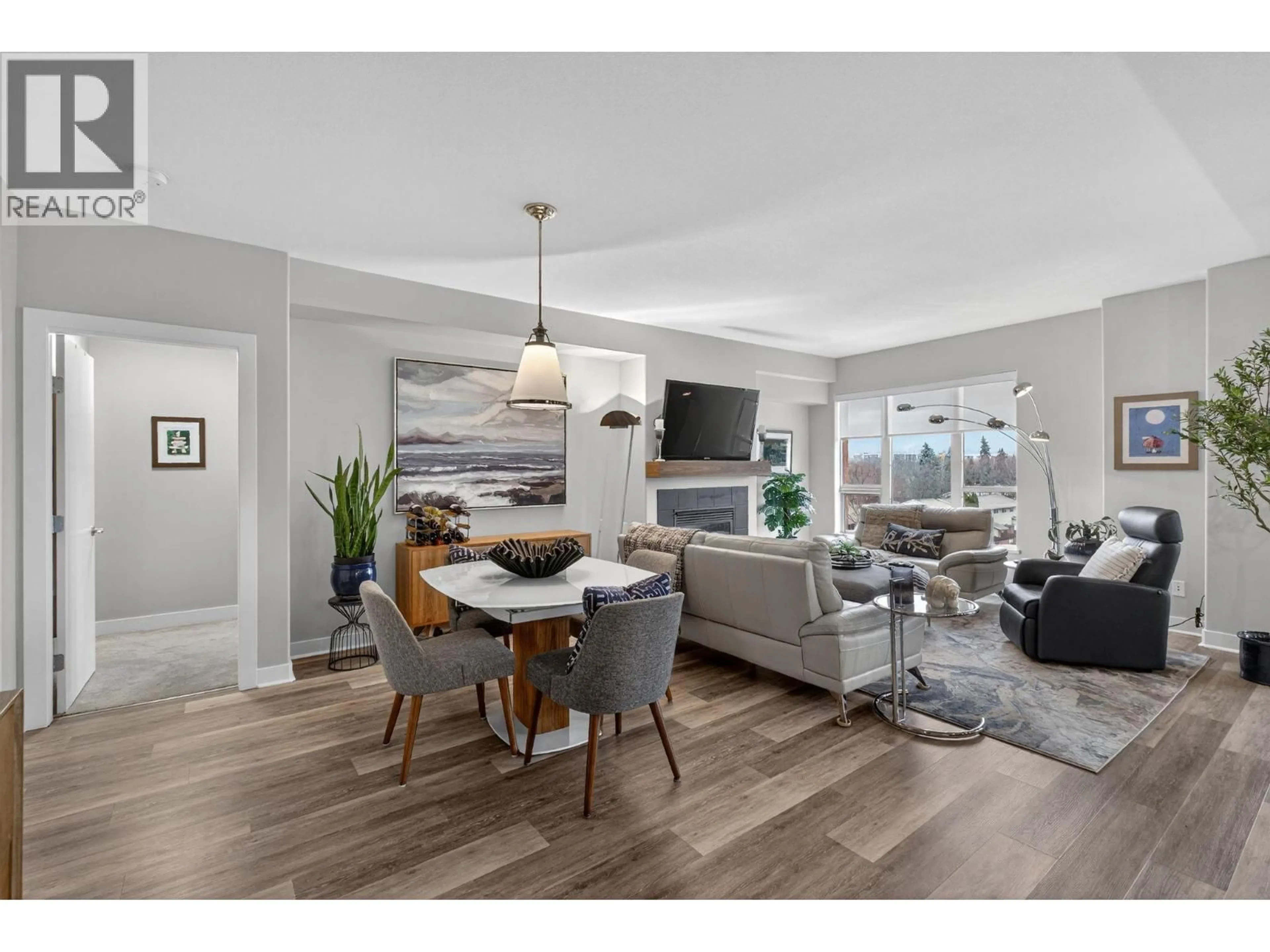 Living room with furniture, wood/laminate floor for 410 - 1160 BERNARD AVENUE, Kelowna British Columbia V1Y6R2