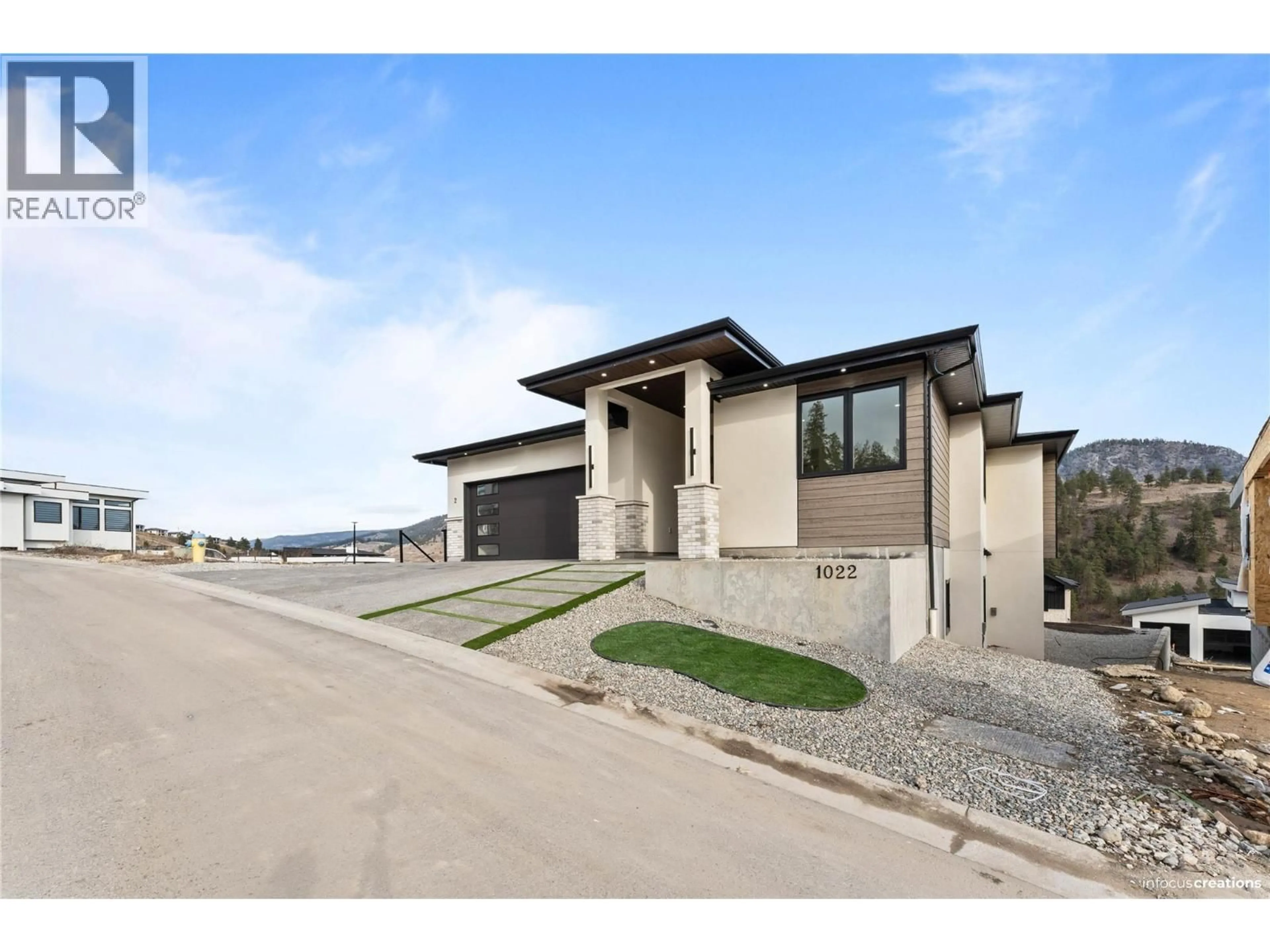 Home with brick exterior material, street for 1022 CARNOUSTIE DRIVE, Kelowna British Columbia V1P0A3