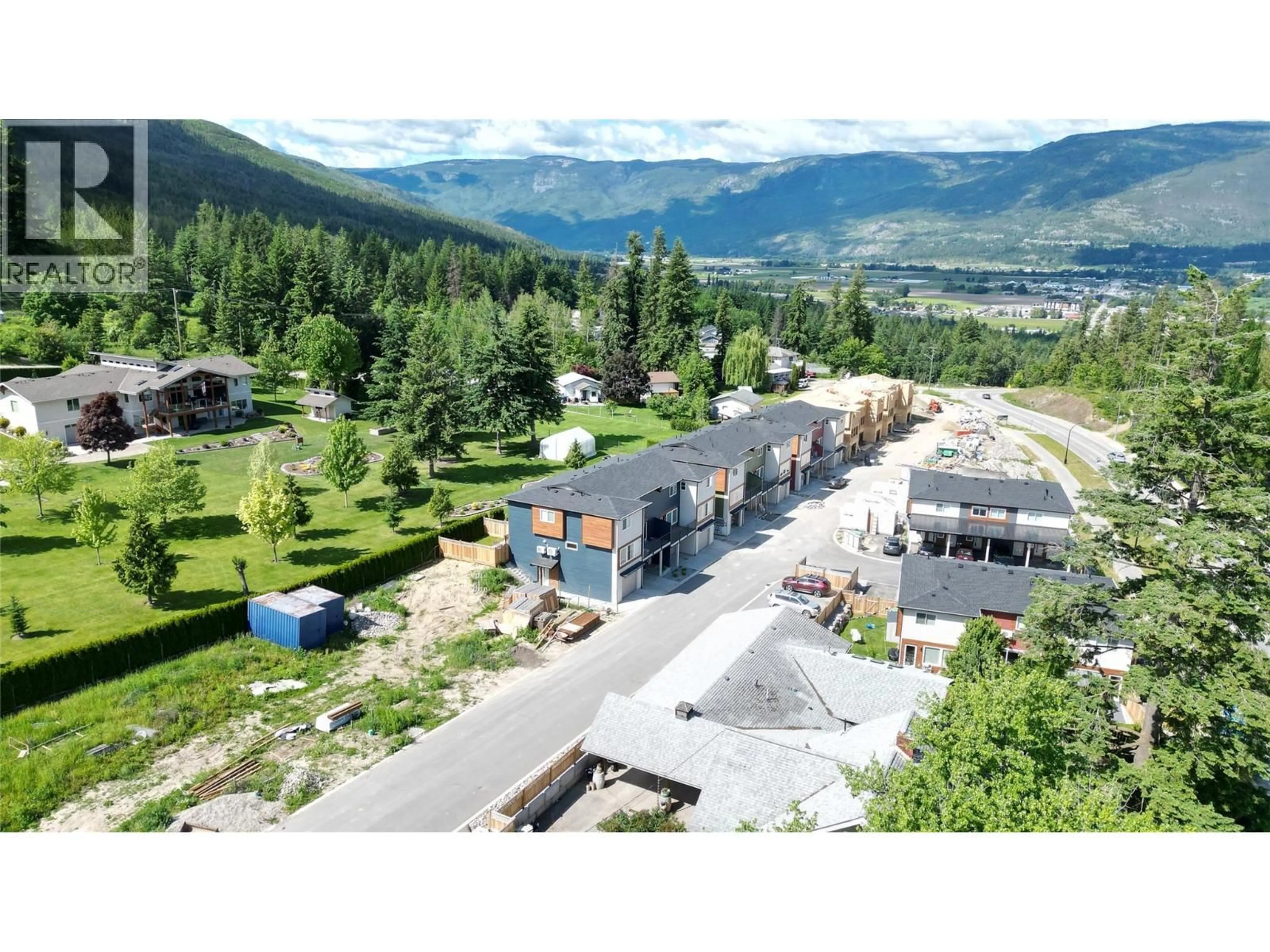 A pic from outside/outdoor area/front of a property/back of a property/a pic from drone, mountain view for 36 - 981 12 STREET SOUTHEAST, Salmon Arm British Columbia V1E2C8