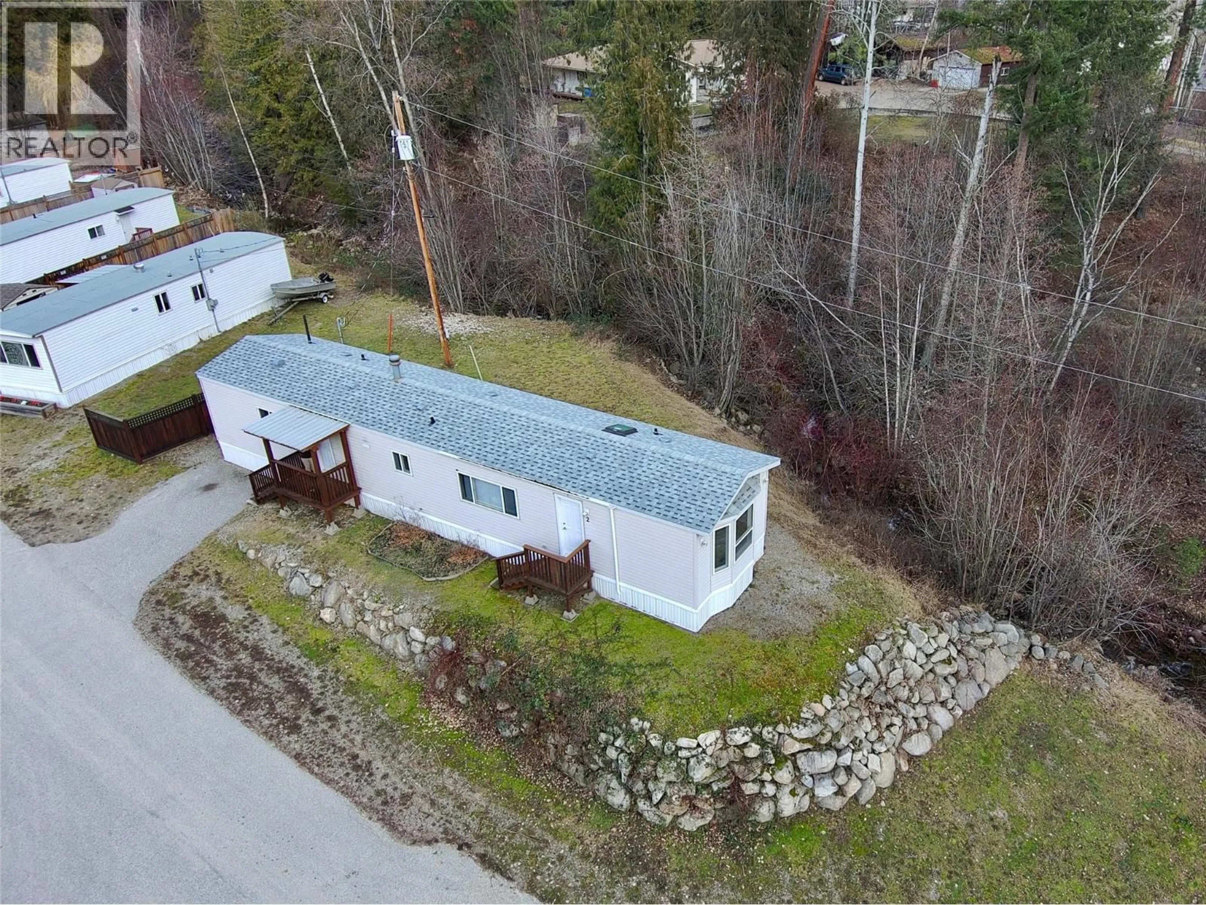 A pic from outside/outdoor area/front of a property/back of a property/a pic from drone, unknown for 2 - 4029 BROADWATER ROAD, Robson British Columbia V1N4V6