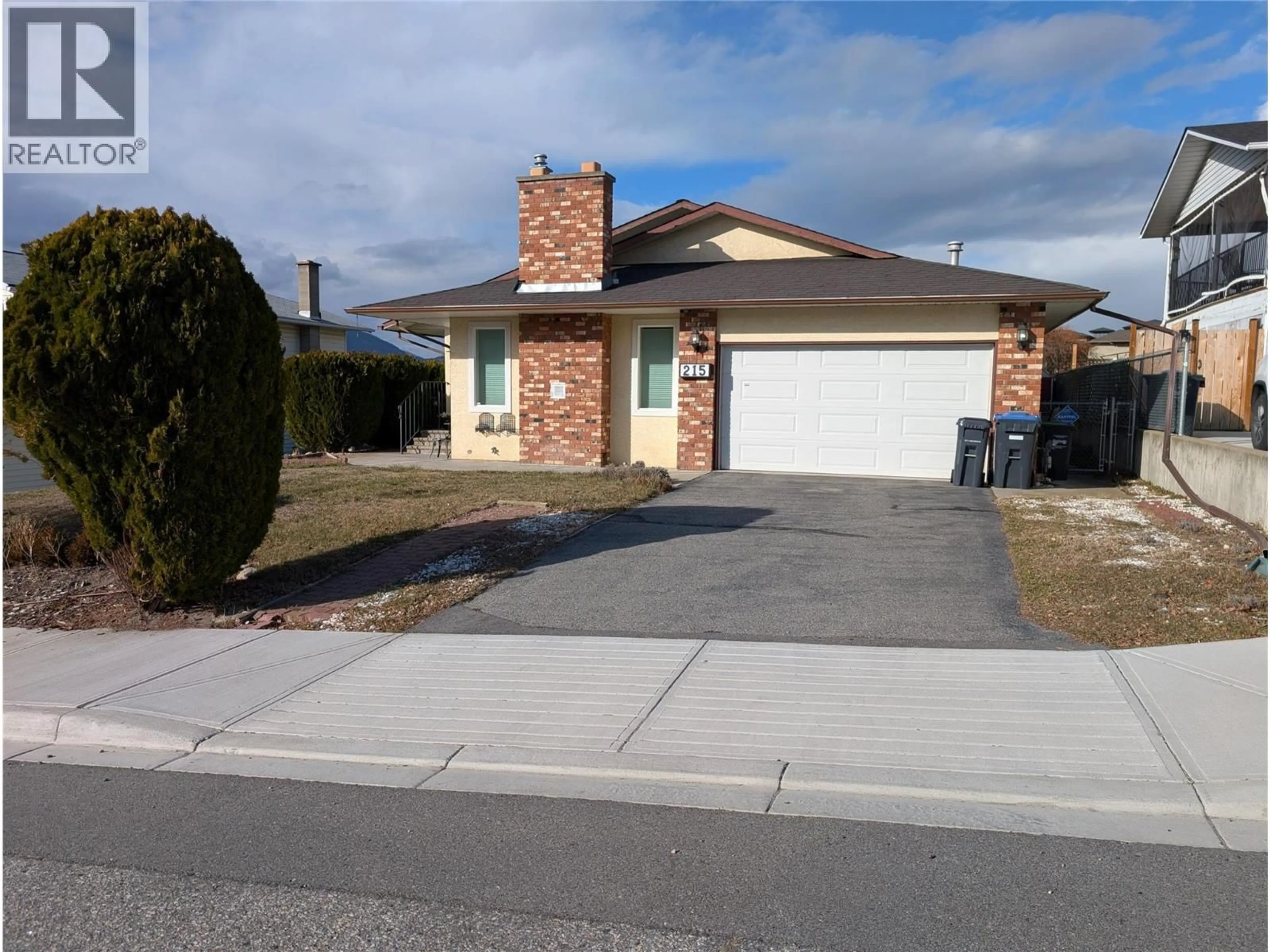 Home with brick exterior material, street for 215 GREENWOOD DRIVE, Penticton British Columbia V2A7P9