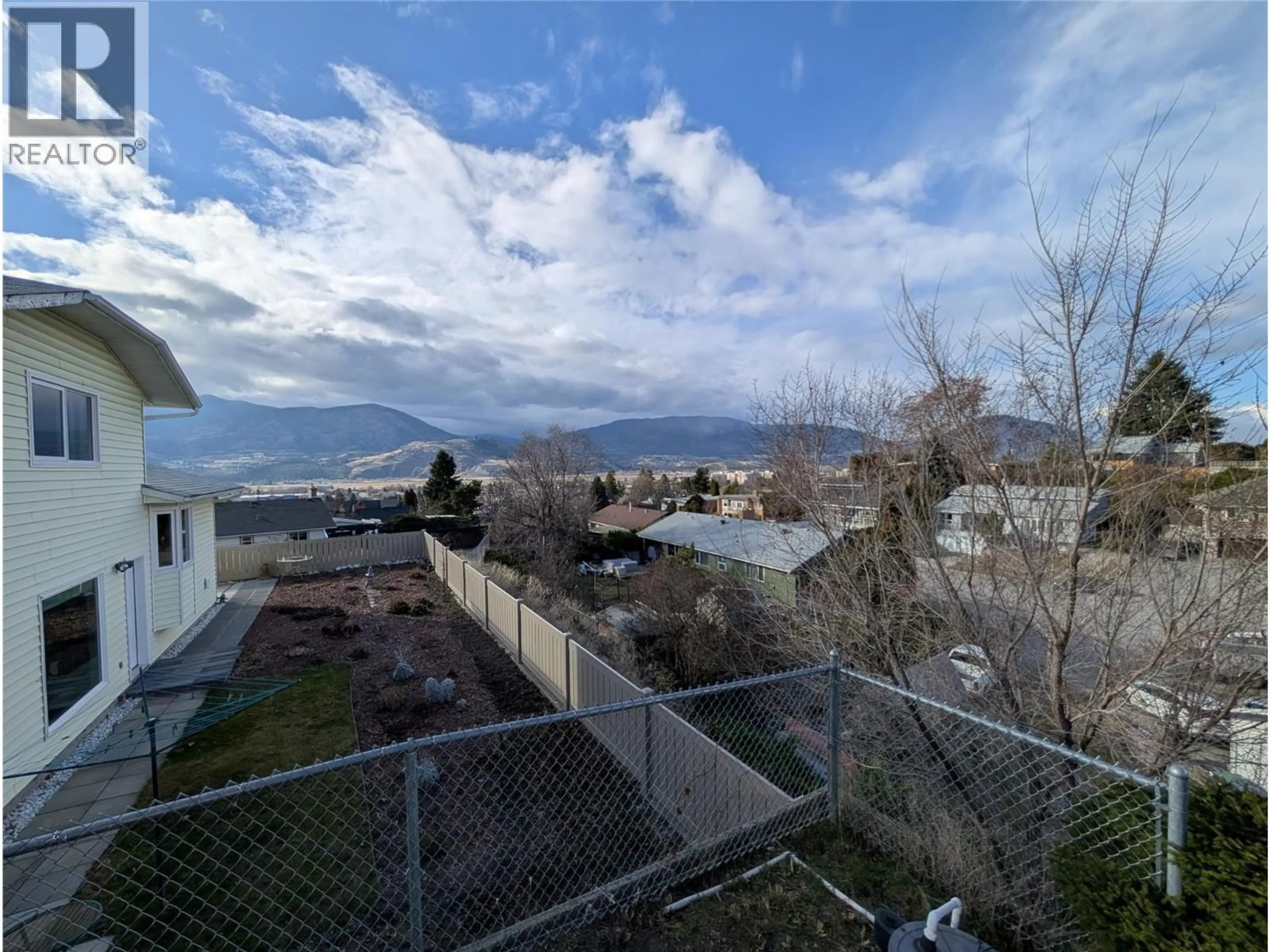 A pic from outside/outdoor area/front of a property/back of a property/a pic from drone, mountain view for 215 GREENWOOD DRIVE, Penticton British Columbia V2A7P9