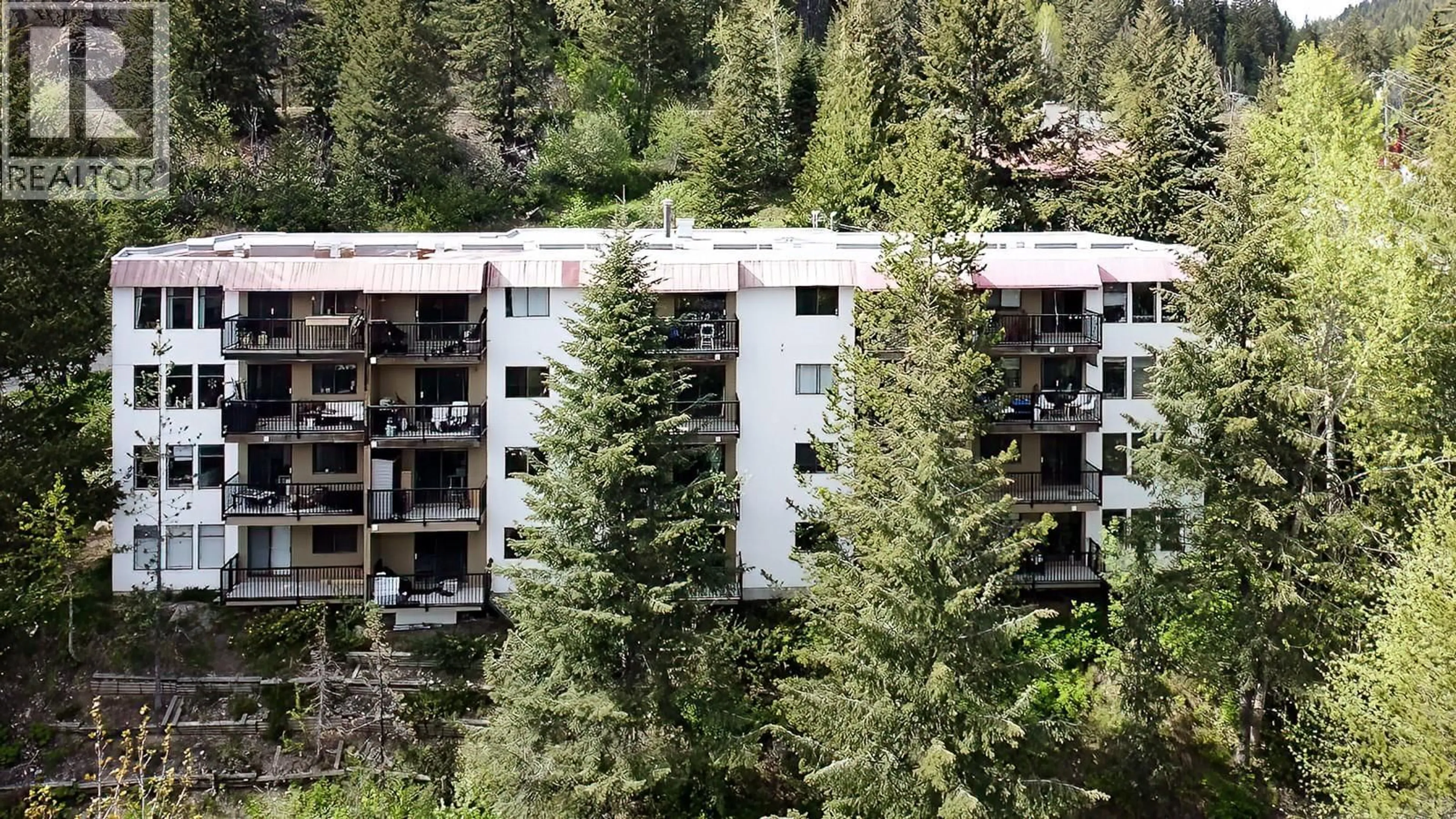 A pic from outside/outdoor area/front of a property/back of a property/a pic from drone, forest/trees view for 306 - 1510 NICKELPLATE STREET, Rossland British Columbia V0G1Y0