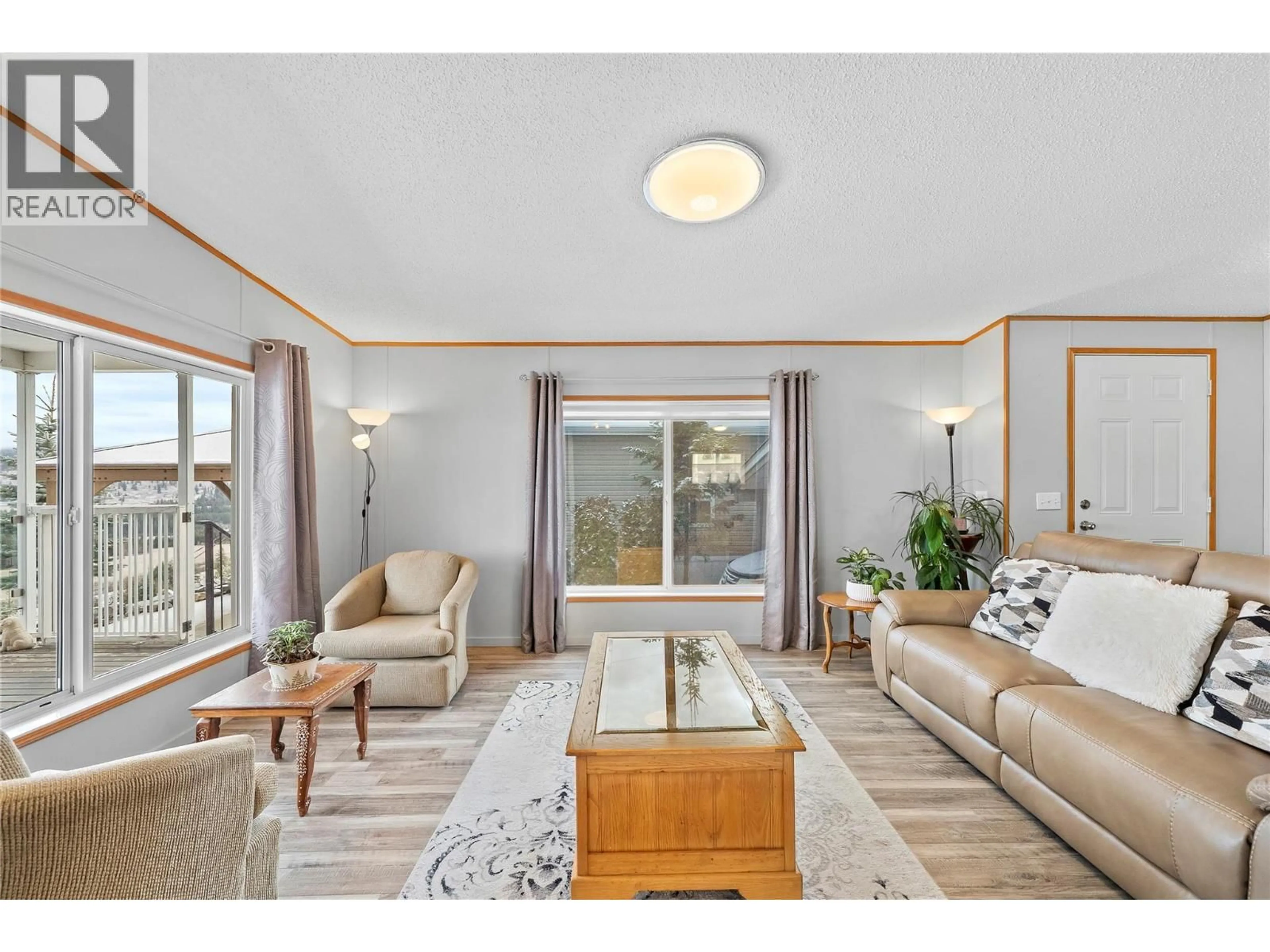 Living room with furniture, wood/laminate floor for 72 - 1885 TAPPEN NOTCH HILL ROAD ROAD, Tappen British Columbia V0E2X0