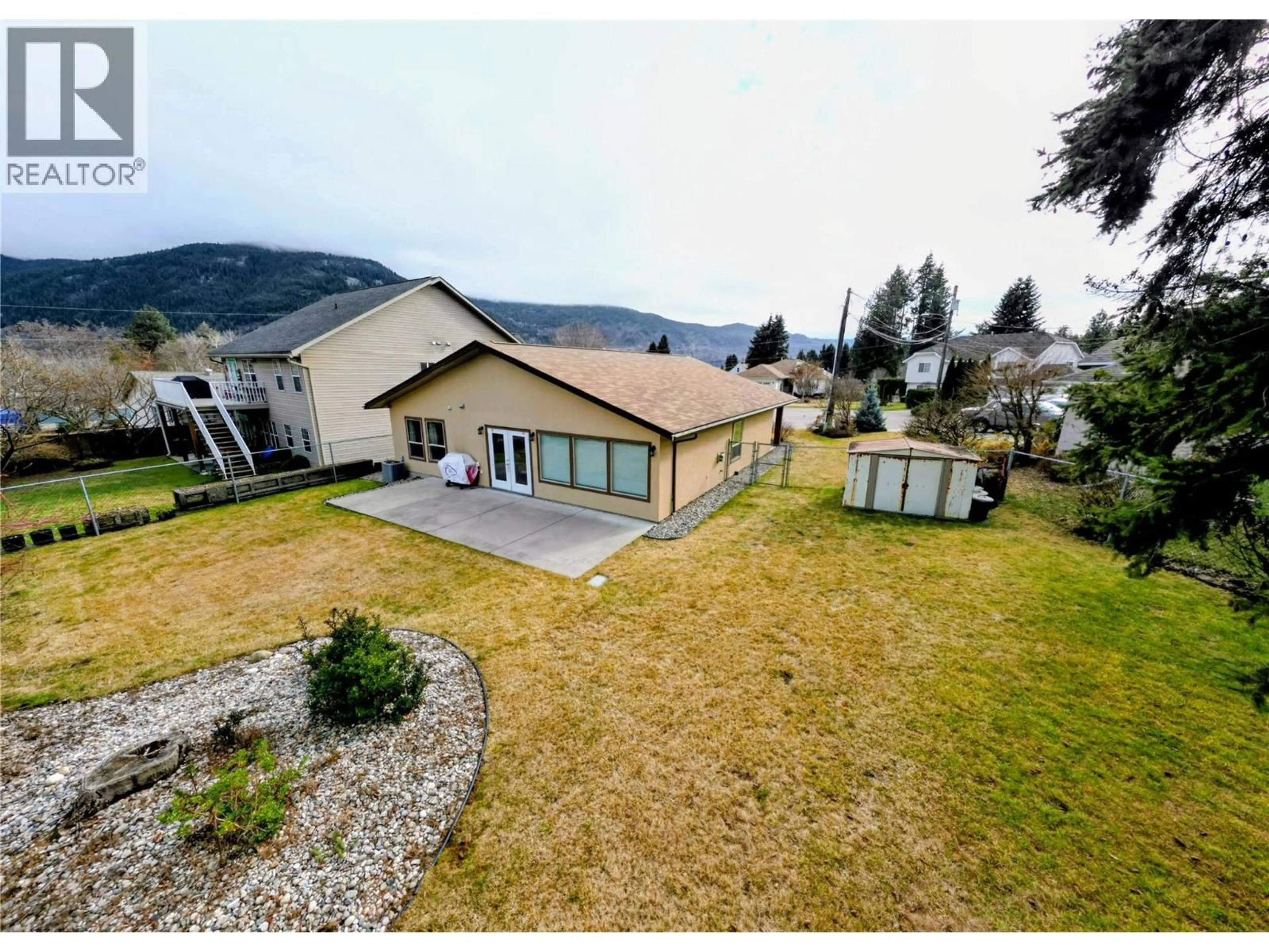 A pic from outside/outdoor area/front of a property/back of a property/a pic from drone, mountain view for 651 HANVILLE PLACE, Castlegar British Columbia V1N4H3
